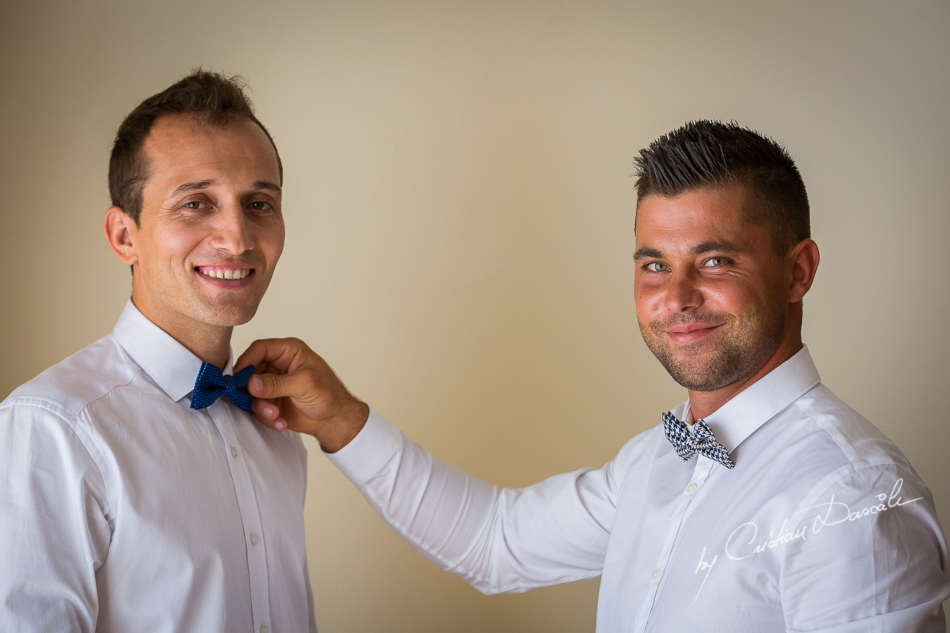 Groom and best man getting ready at Elias Beach Hotel in Limassol
