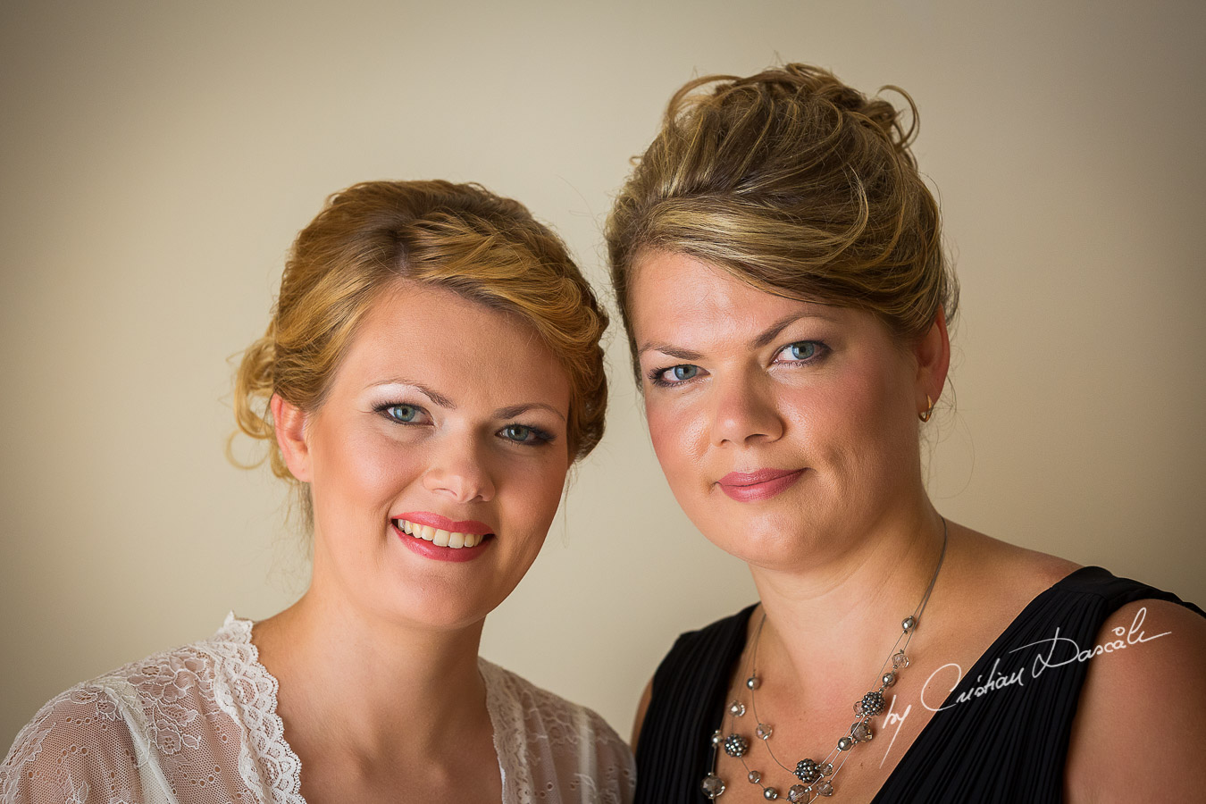 Bride Daria and her sister photographed few moments before the wedding at Elias Beach Hotel in Limassol