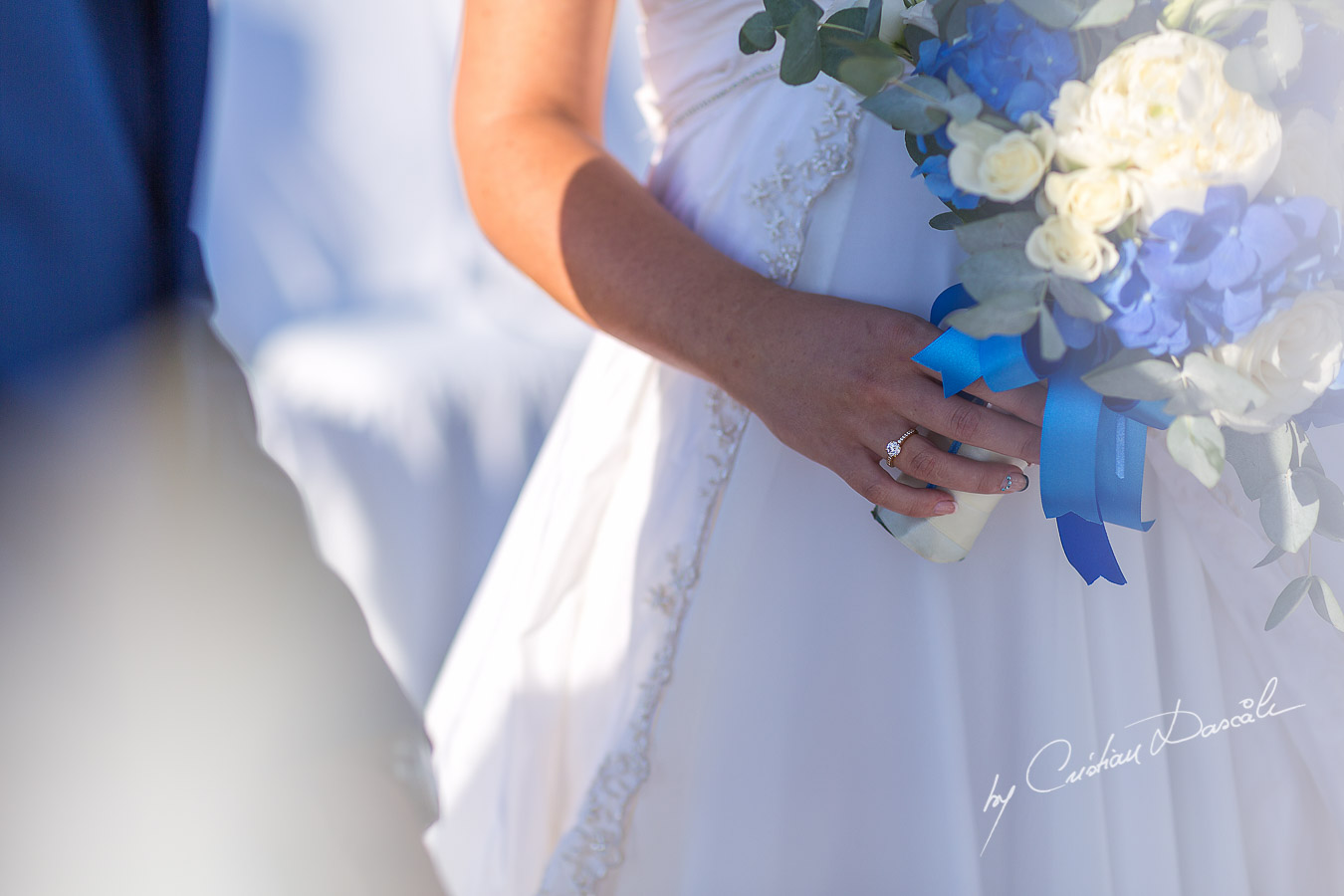 Engagement ring photographed during wedding ceremony at Elias Beach Hotel in Limassol