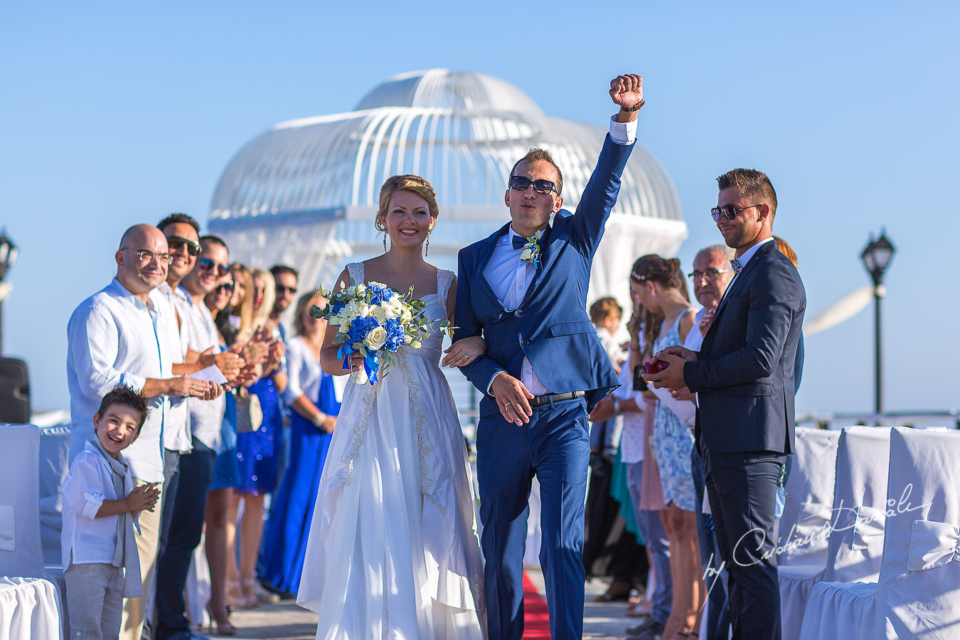 Just seconds after the ceremony, the groom is showing his enthusiasm at Elias Beach Hotel in Limassol