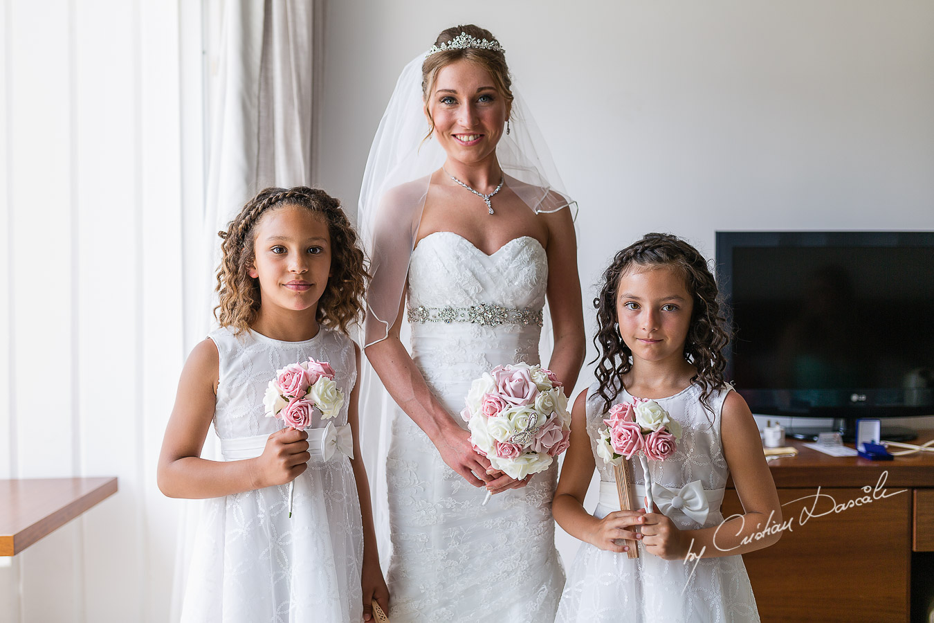 Beautiful bride Alicia and flower girls photographed at Nissi Beach Resort in Ayia Napa, Cyprus by Cristian Dascalu.