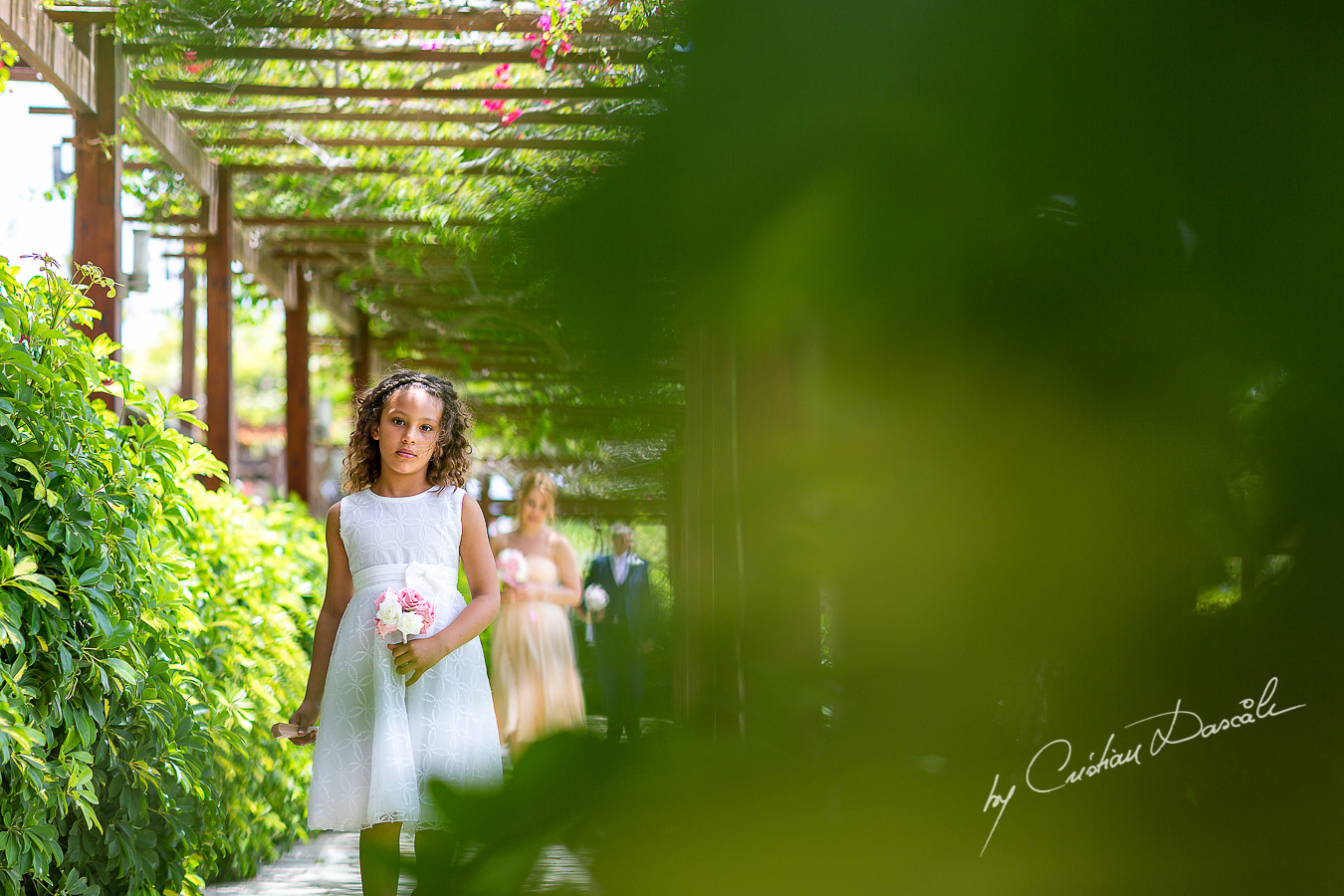 Gorgeous flower girl photographed at Nissi Beach Resort in Ayia Napa, Cyprus by Cristian Dascalu.