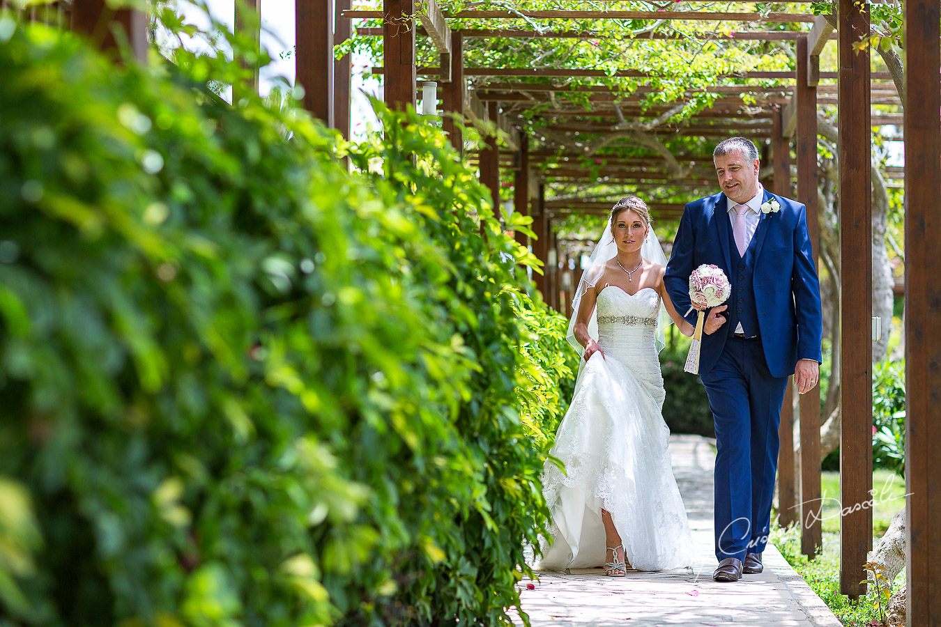 Bride Alicia and her father photographed at Nissi Beach Resort in Ayia Napa, Cyprus by Cristian Dascalu.