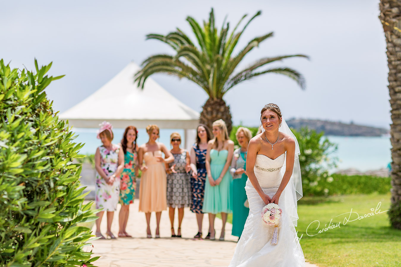 Alicia tossing the bouquet, moment photographed at Nissi Beach Resort in Ayia Napa, Cyprus by Cristian Dascalu.