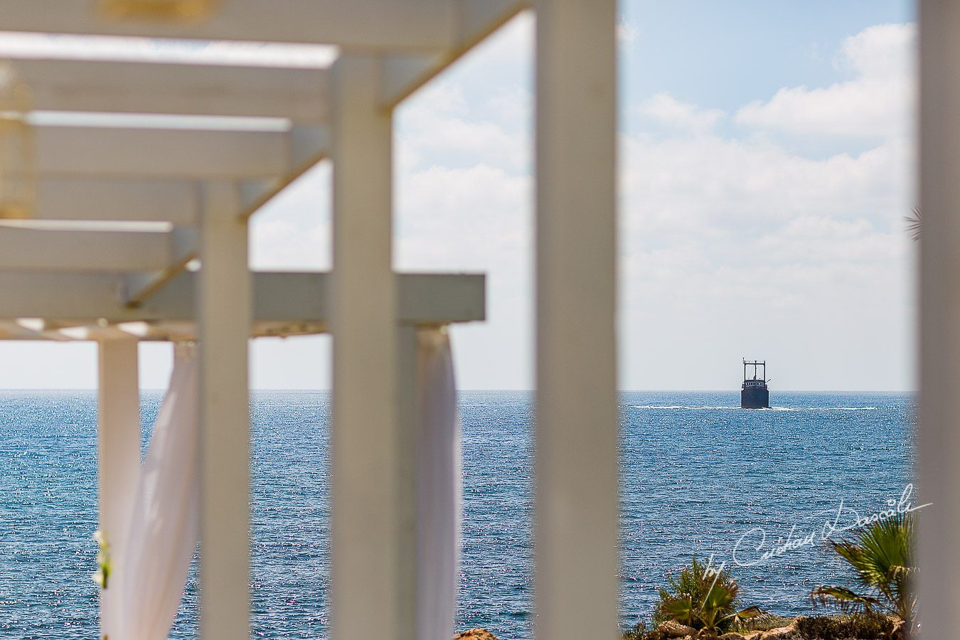 Ship wreck off coast of Paphos seen from wedding ceremony at King Evelton Beach and Resort.