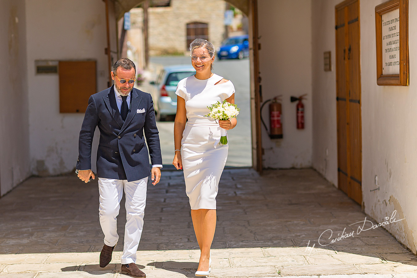 The bride and the groom arrive at Germasoia Cultural Center in Limassol.
