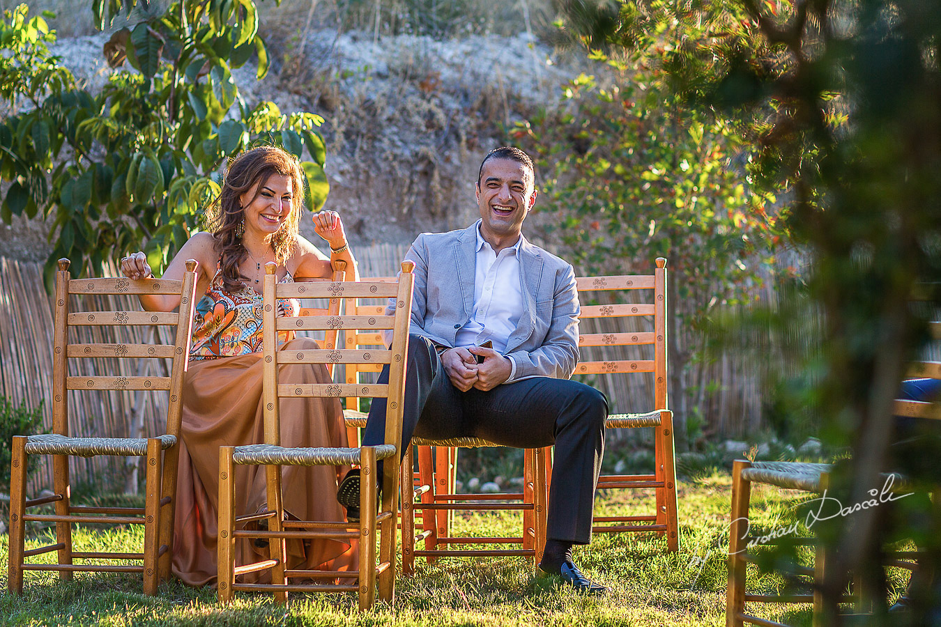 Guests laughing at a beautiful bohemian wedding in Trimiklini.