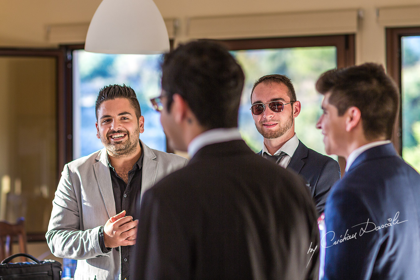 Guests laughing at a beautiful bohemian wedding in Trimiklini.