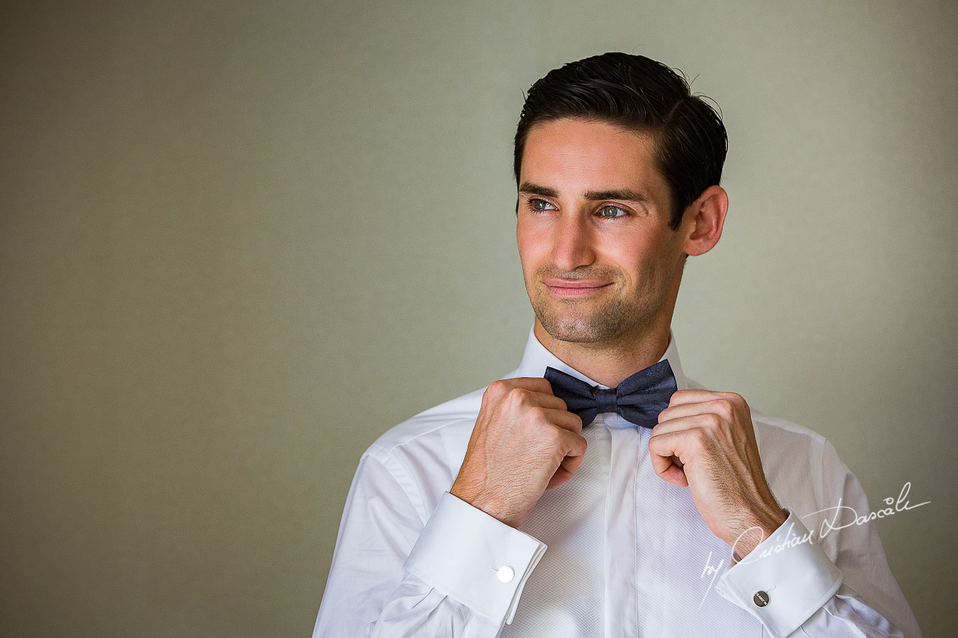 Groom Chris posing at his wedding in Ayia Napa, Cyprus by Cristian Dascalu.