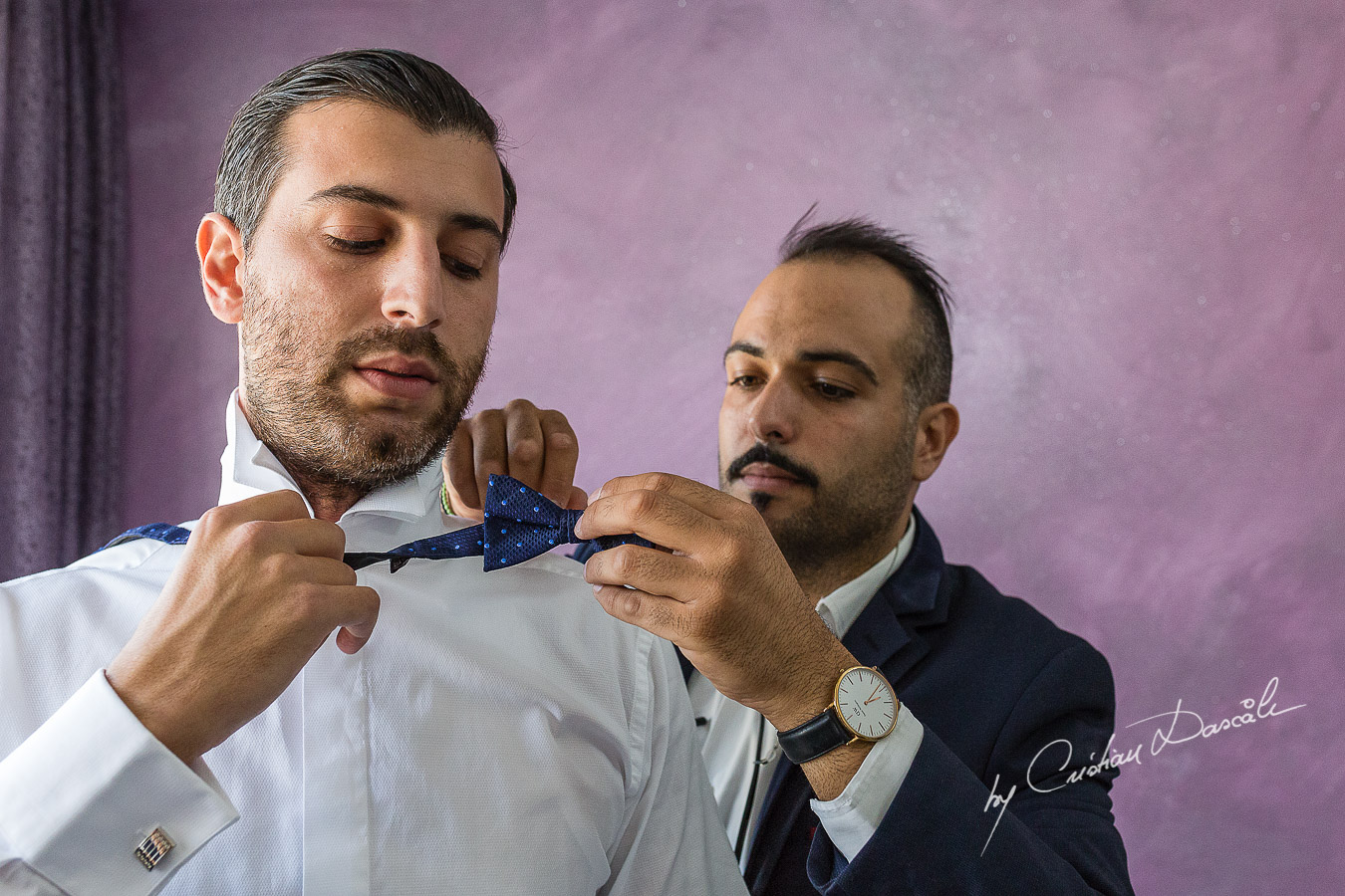 Moments from the groom's getting ready captured at an elegant and romantic wedding at Elias Beach Hotel by Cristian Dascalu.