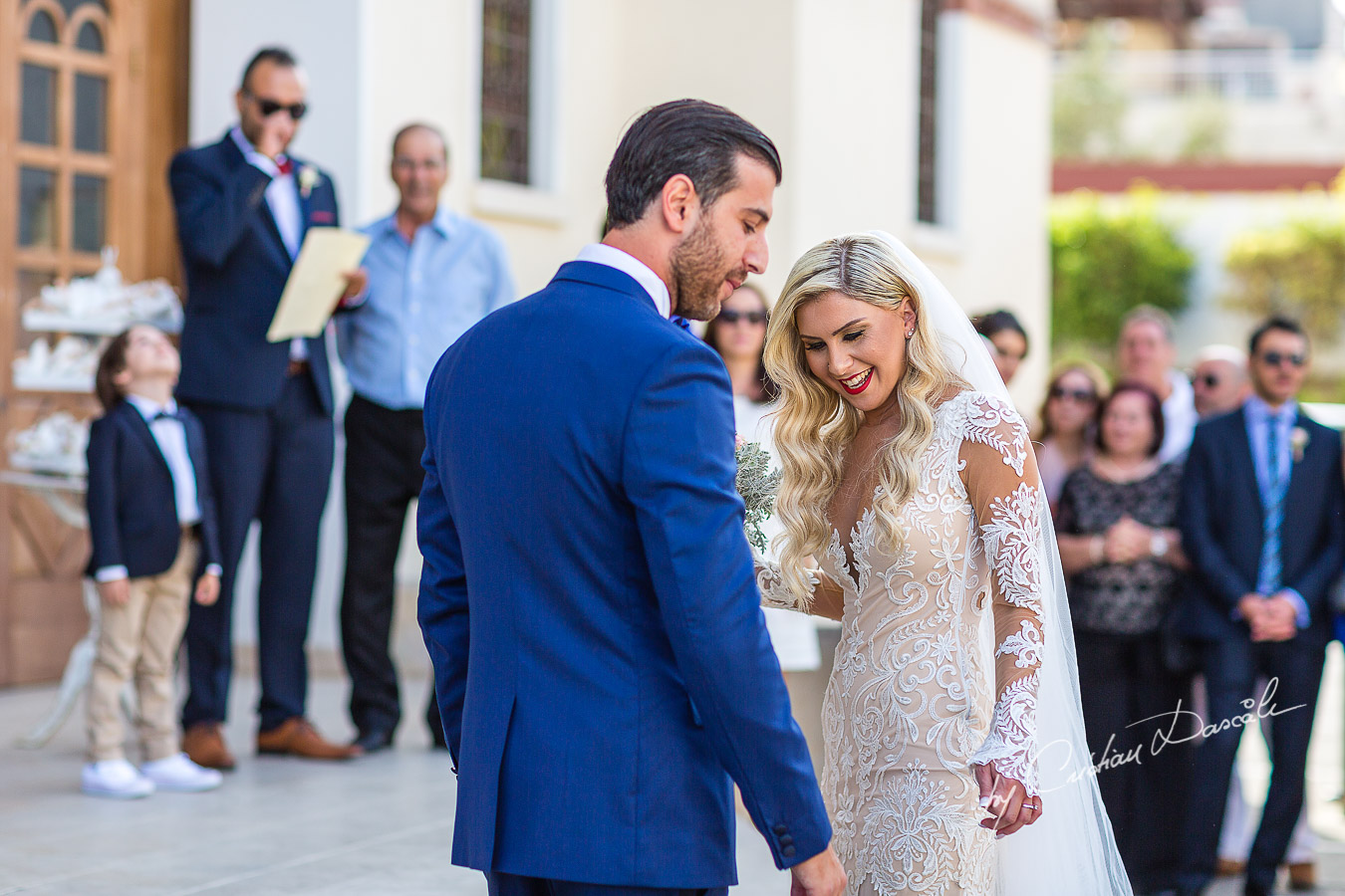 Moments before the church ceremony captured at an elegant and romantic wedding at Elias Beach Hotel by Cristian Dascalu.