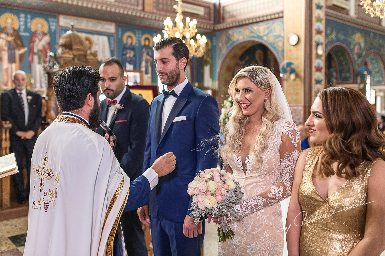 Church ceremony moments captured at an elegant and romantic wedding at Elias Beach Hotel by Cristian Dascalu.