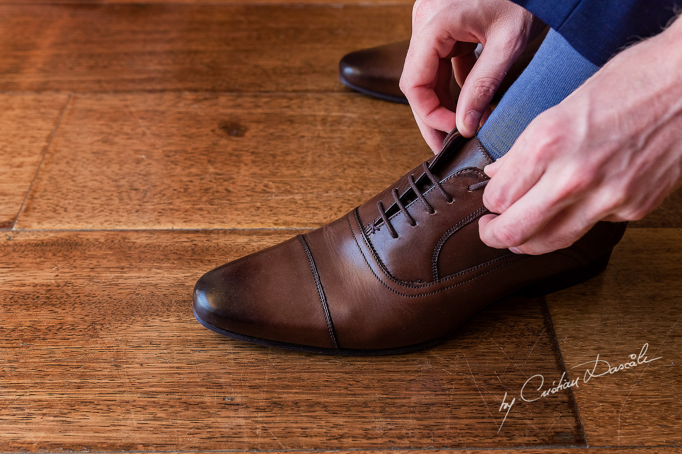 Groom's details at Aphrodite Hills Resort captured during a wedding by Cristian Dascalu.