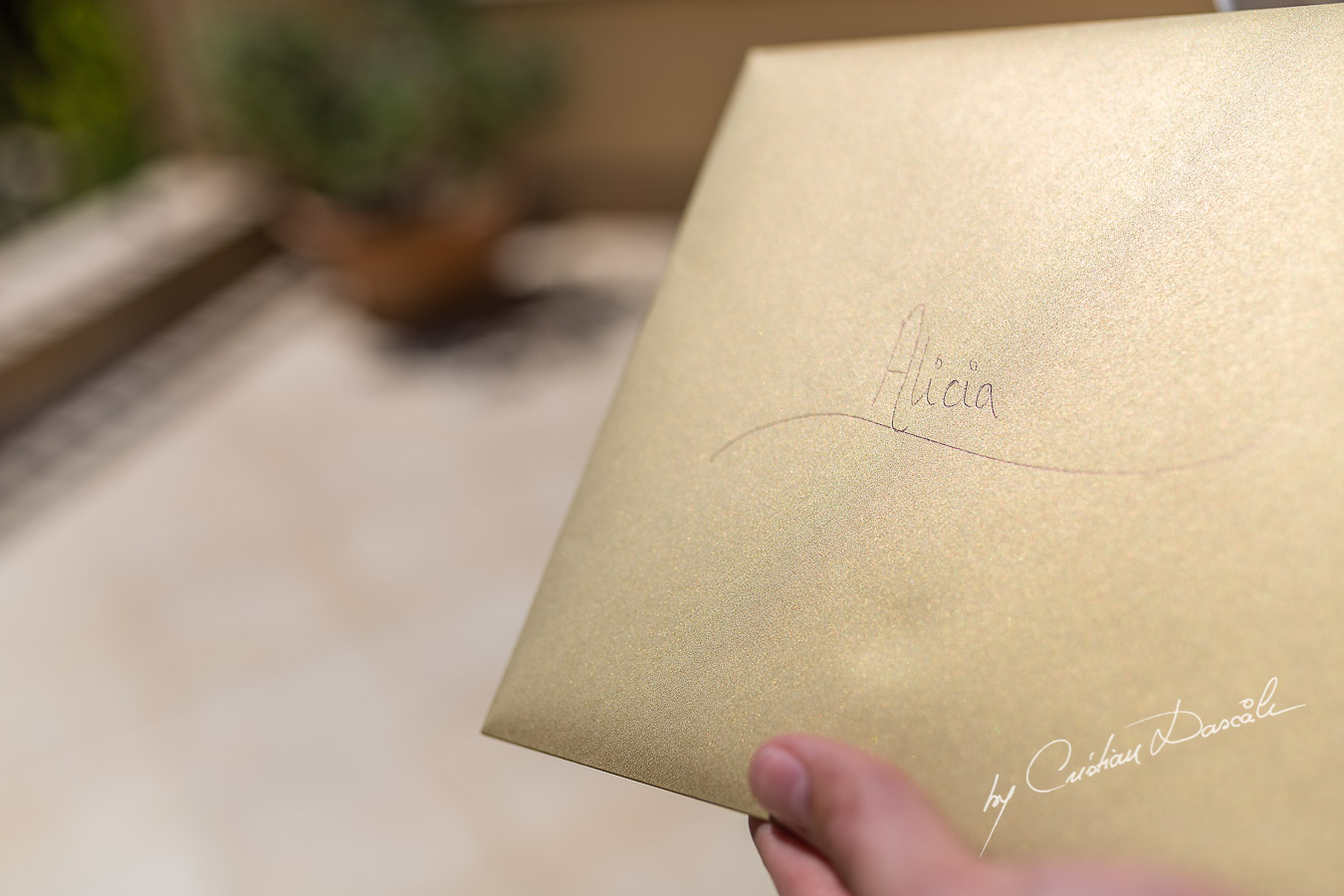 The envelop is given to the Bride by the Bestman captured at Aphrodite Hills Resort before the wedding ceremony by Cristian Dascalu.