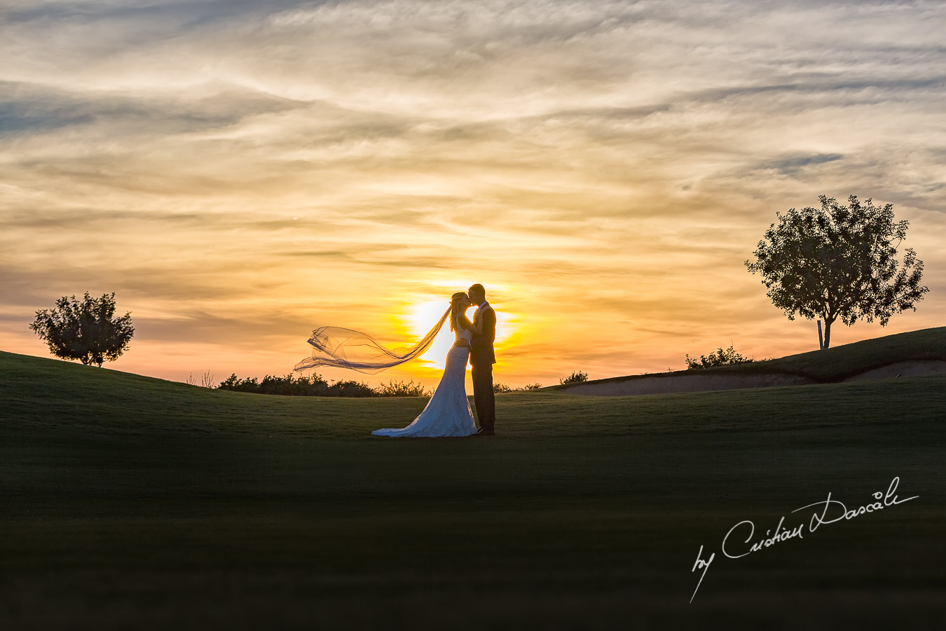 Sunset photoshoot moments captured by Cristian Dascalu at a wedding at The Aphrodite Hills Resort in Paphos, Cyprus.