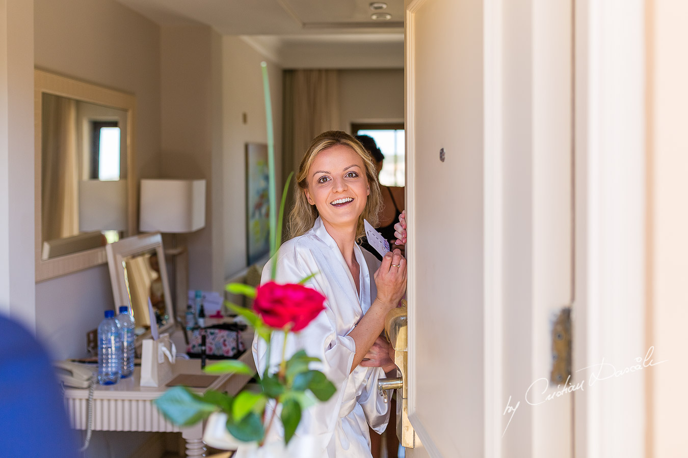 Beautiful moment captured when the Bestman delivers a flower on behalf of the Groom, at an amazing wedding at Aphrodite Hills Resort in Cyprus.