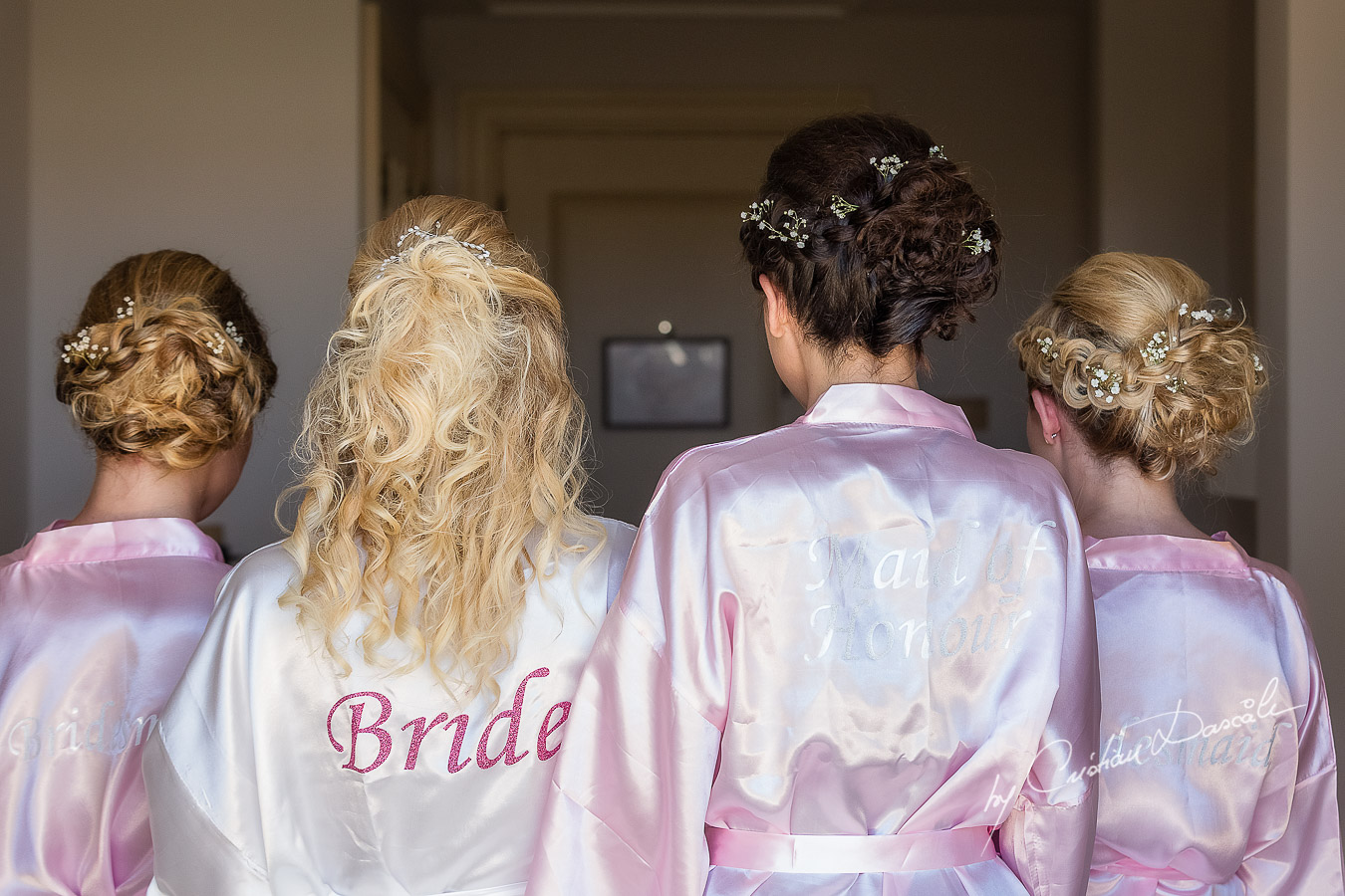 Team Bride is being photographed in the Bridal robe before getting ready at Aphrodite Hills Resort by wedding photographer Cristian Dascalu.