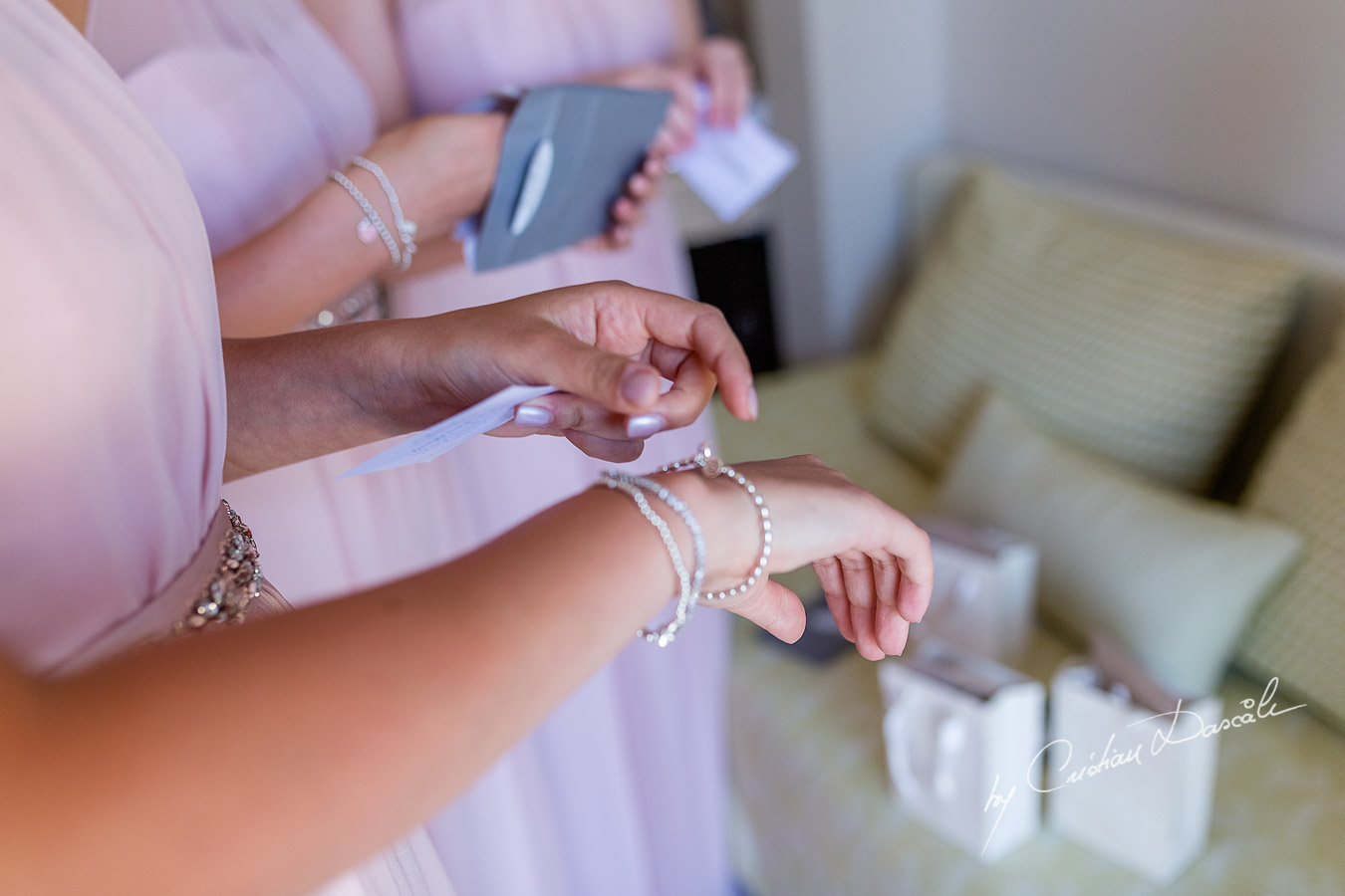 Emotional moment between the bride and maid of honor captured during a wedding at Aphrodite Hills Resort in Cyprus by Cyprus Photographer Cristian Dascalu.