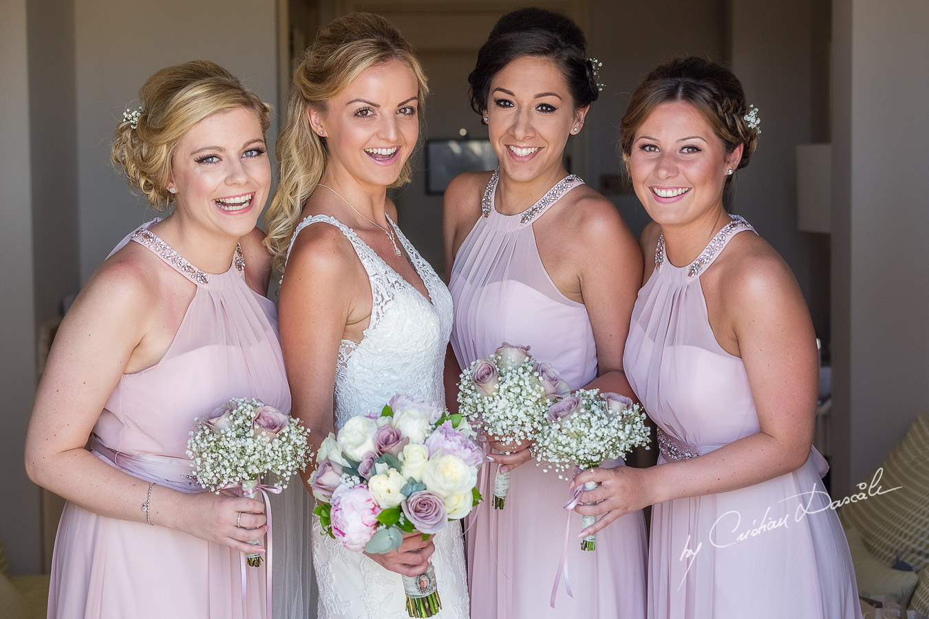 Emotional moment between the bride and maid of honor captured during a wedding at Aphrodite Hills Resort in Cyprus by Cyprus Photographer Cristian Dascalu.