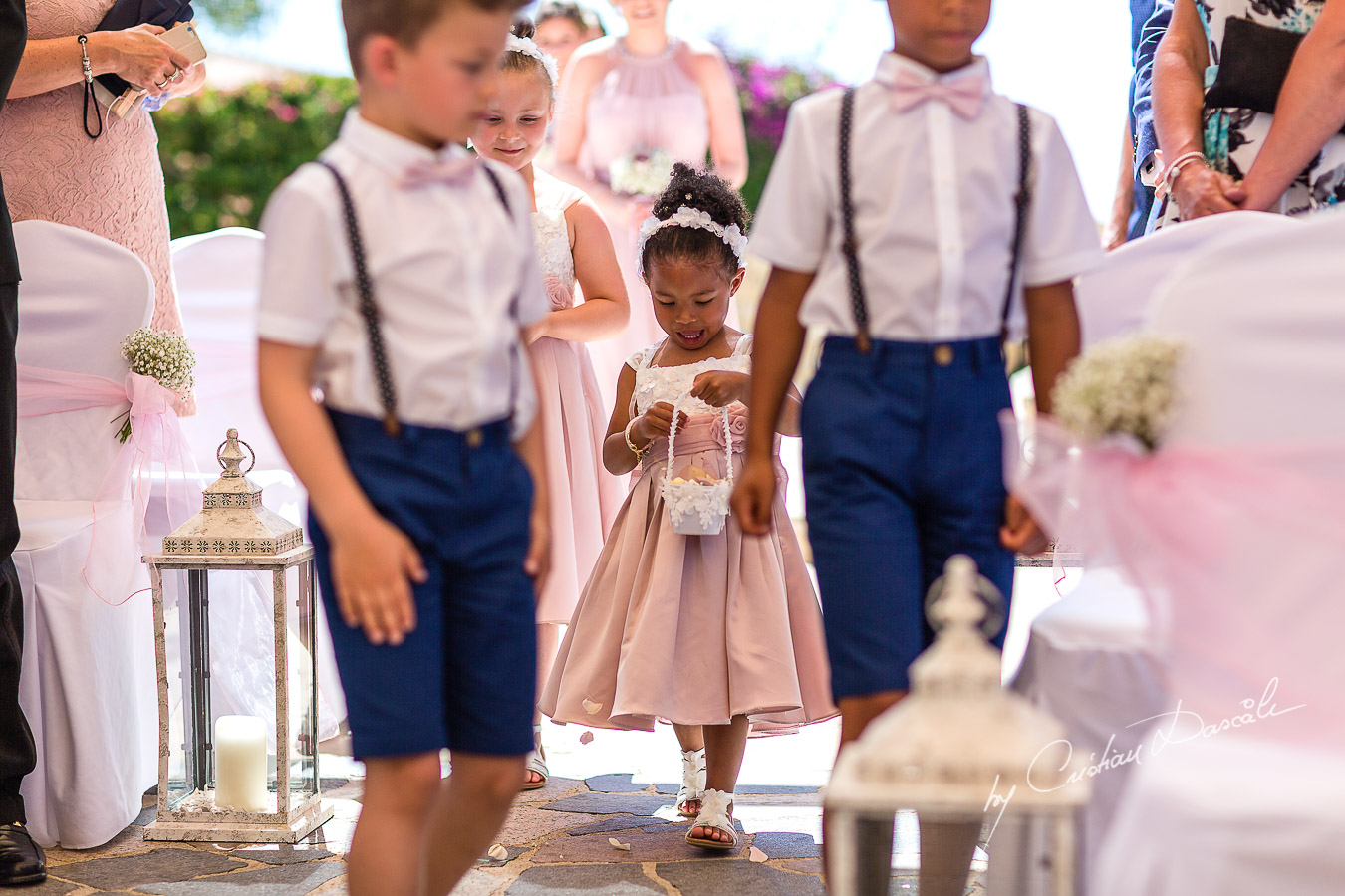 Moments with pageboys and flowergirls captured during a wedding at Aphrodite Hills Resort in Cyprus by Cyprus Photographer Cristian Dascalu.