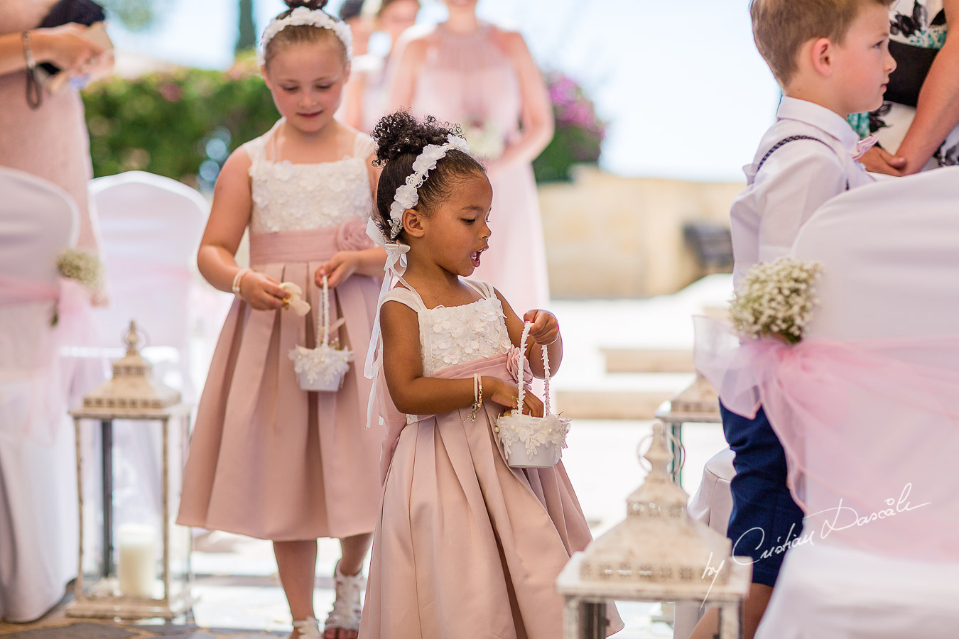 Moments with pageboys and flowergirls captured during a wedding at Aphrodite Hills Resort in Cyprus by Cyprus Photographer Cristian Dascalu.