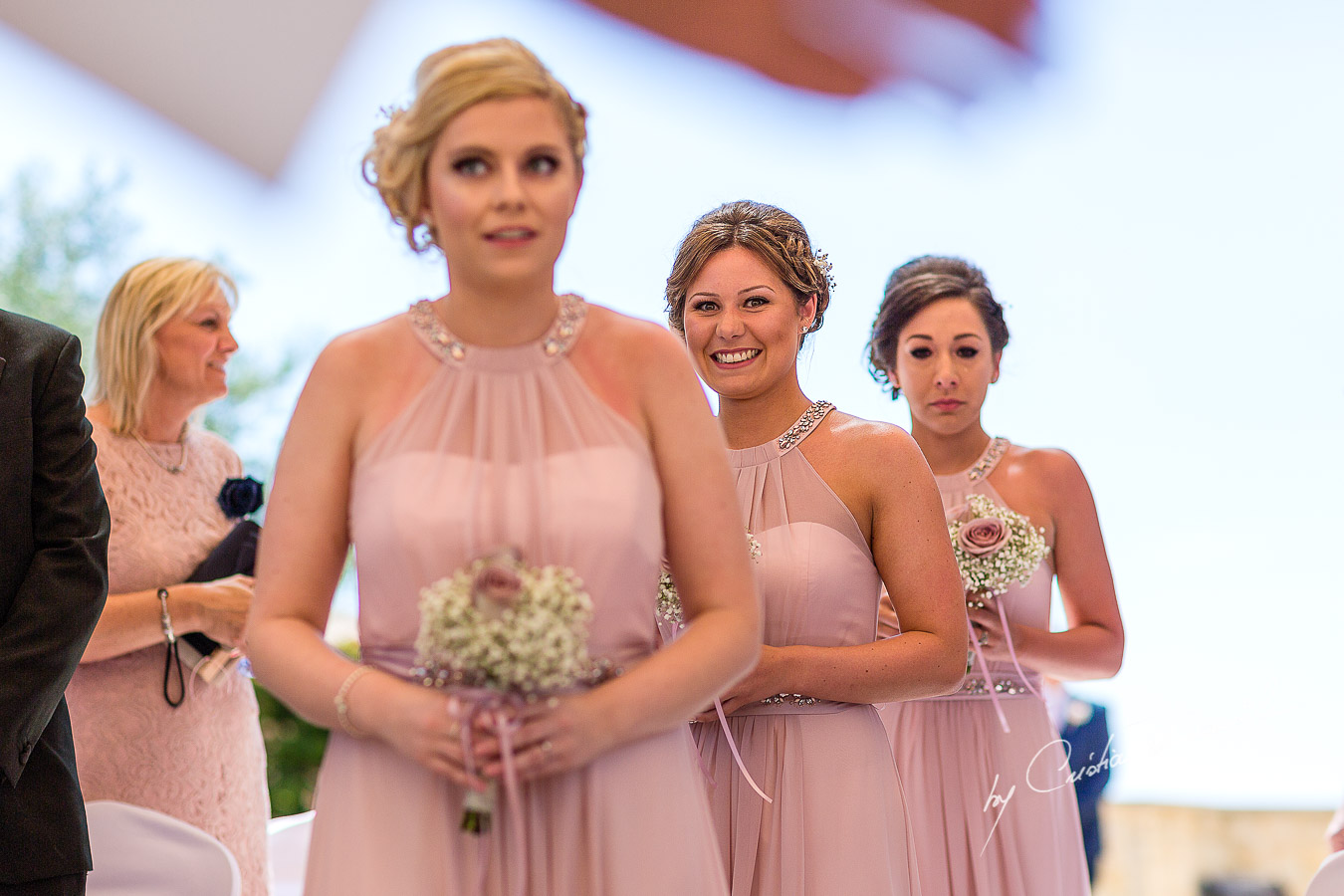 The moment when the bridesmaids arrive at the wedding ceremony at Aphrodite Hills Resort in Cyprus, captured by photographer Cristian Dascalu.