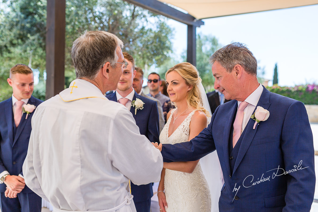 The father of the bride's reaction when the bride arrives at the wedding ceremony at Aphrodite Hills Resort in Cyprus, captured by photographer Cristian Dascalu.