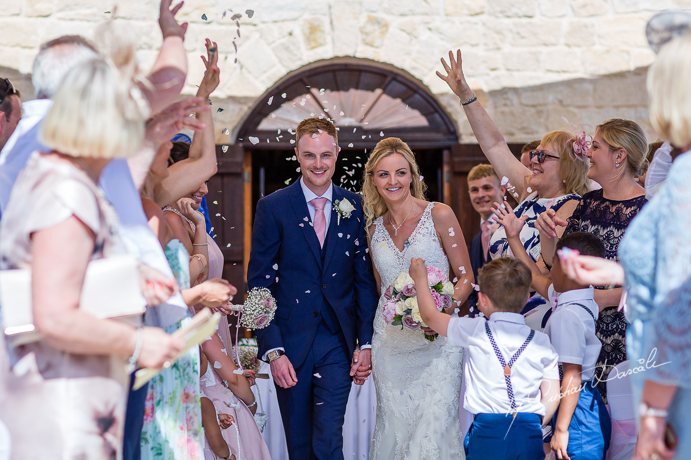 Moments captured immediately after the wedding ceremony at Aphrodite Hills Resort in Cyprus, captured by photographer Cristian Dascalu.