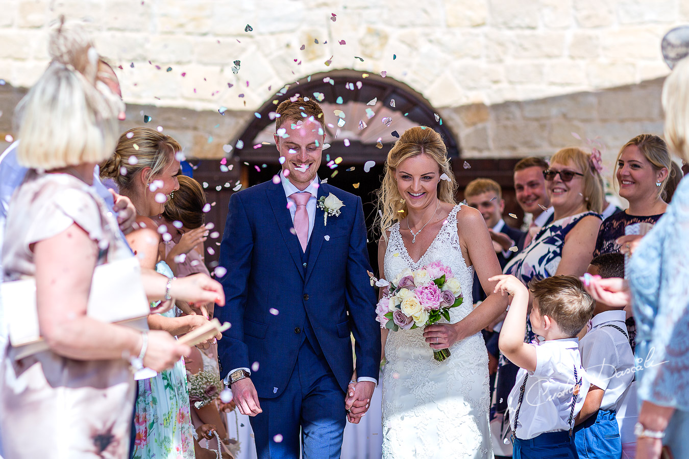 Moments captured immediately after the wedding ceremony at Aphrodite Hills Resort in Cyprus, captured by photographer Cristian Dascalu.