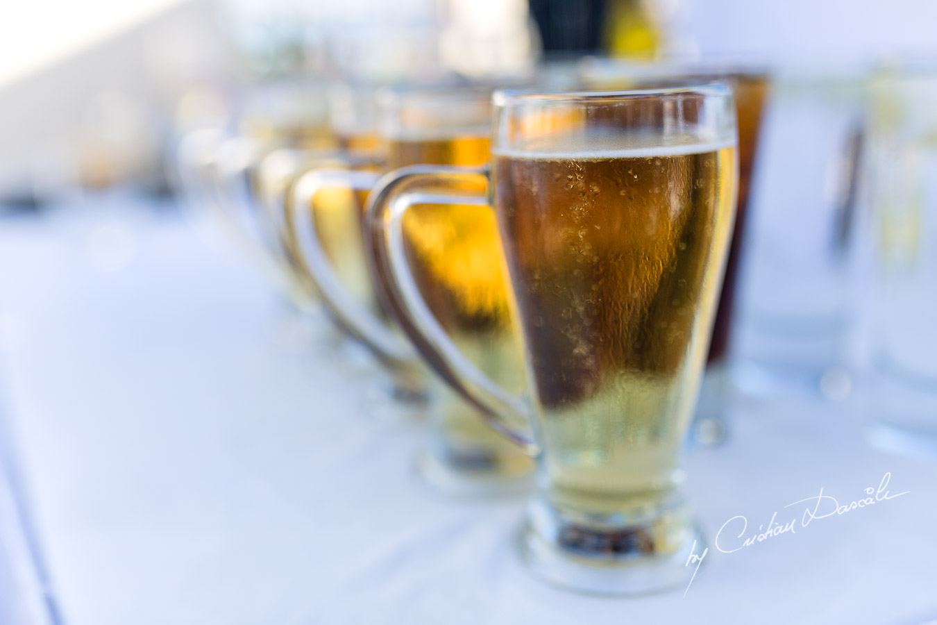 Cold beer on a hot day, captured by Cristian Dascalu at a wedding at The Aphrodite Hills Resort in Paphos, Cyprus.