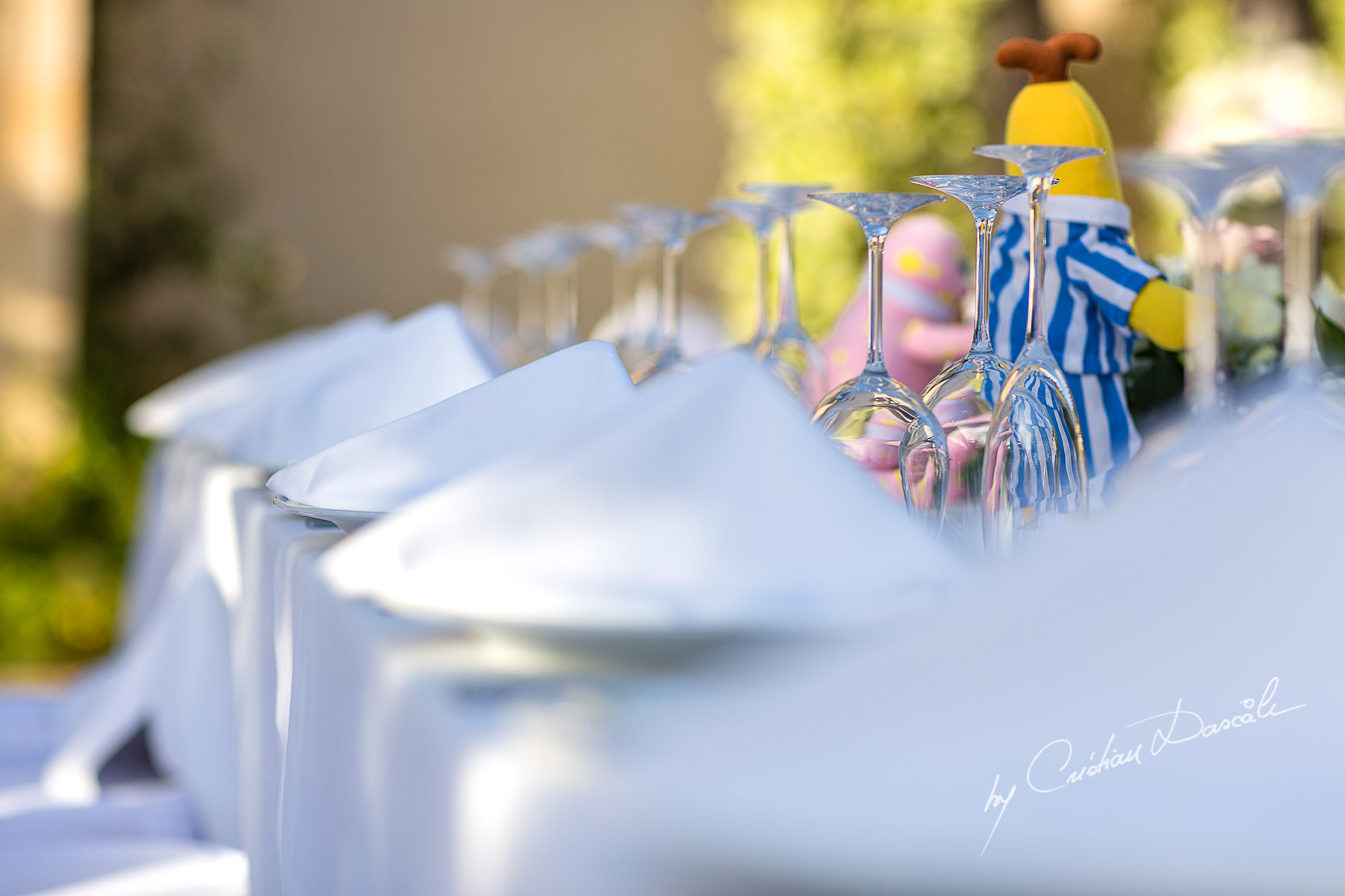 Beautiful wedding table decorations captured by Cristian Dascalu at a wedding at The Aphrodite Hills Resort in Paphos, Cyprus.