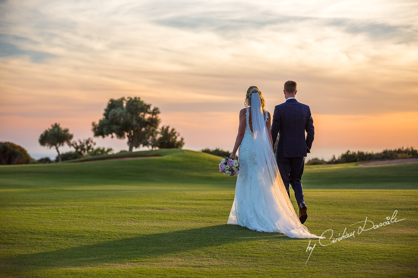 Sunset photoshoot moments captured by Cristian Dascalu at a wedding at The Aphrodite Hills Resort in Paphos, Cyprus.