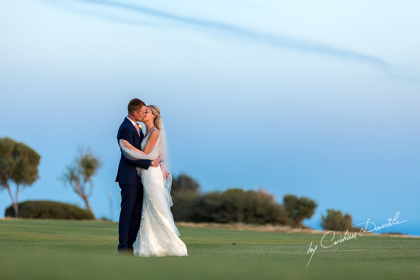 Sunset photoshoot moments captured by Cristian Dascalu at a wedding at The Aphrodite Hills Resort in Paphos, Cyprus.
