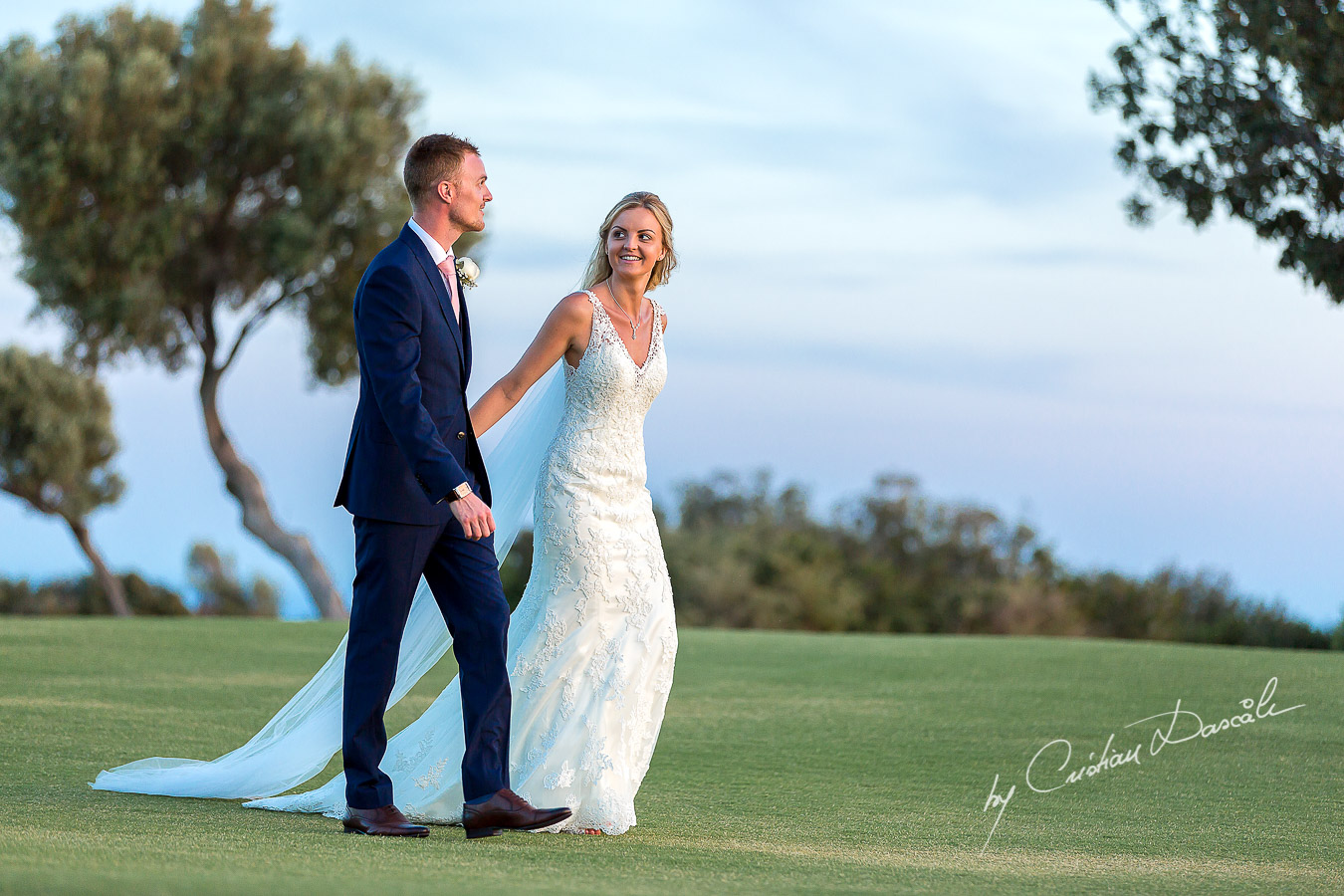 Sunset photoshoot moments captured by Cristian Dascalu at a wedding at The Aphrodite Hills Resort in Paphos, Cyprus.