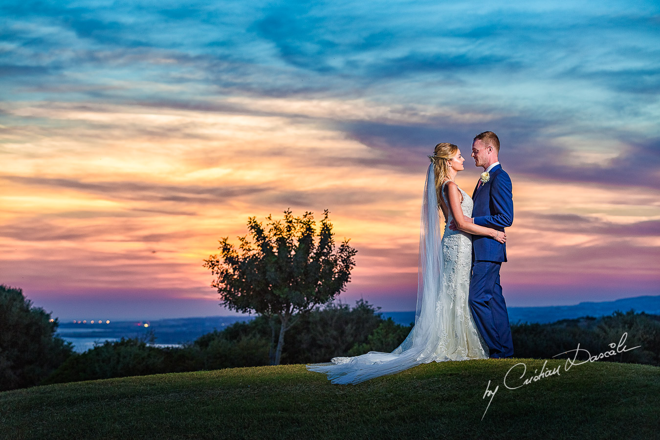 Sunset photoshoot moments captured by Cristian Dascalu at a wedding at The Aphrodite Hills Resort in Paphos, Cyprus.