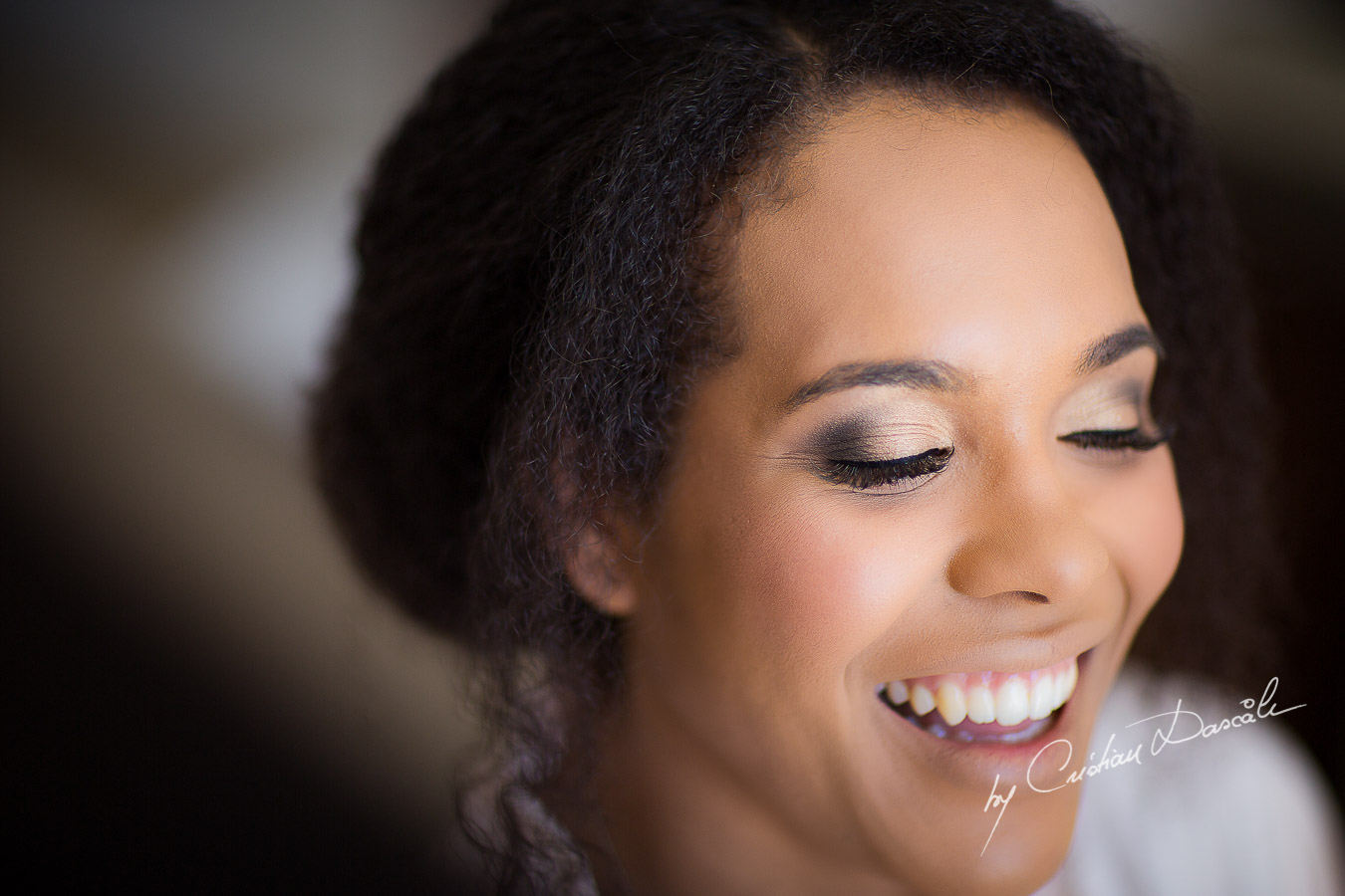 Beautiful smile of the bride Joanna captured at her wedding at Minthis Hills in Cyprus, by Cristian Dascalu.