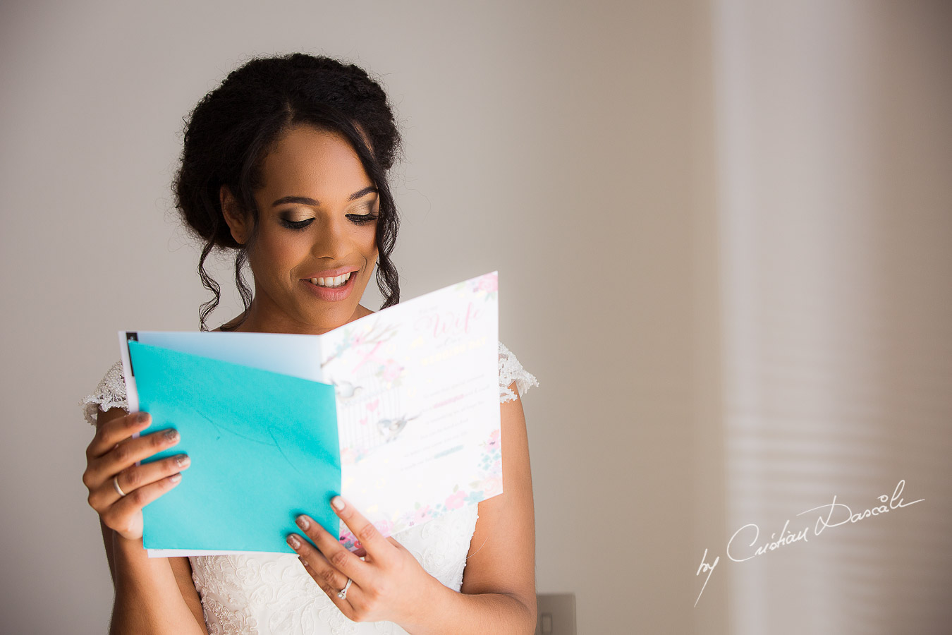 The bride reading her letter from the groom, moments captured at a wedding at Minthis Hills in Cyprus, by Cristian Dascalu.