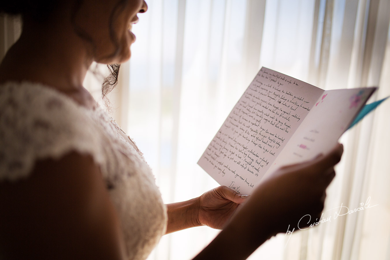 Genuine moments when the bride is reading her letter from the groom captured at a wedding at Minthis Hills in Cyprus, by Cristian Dascalu.