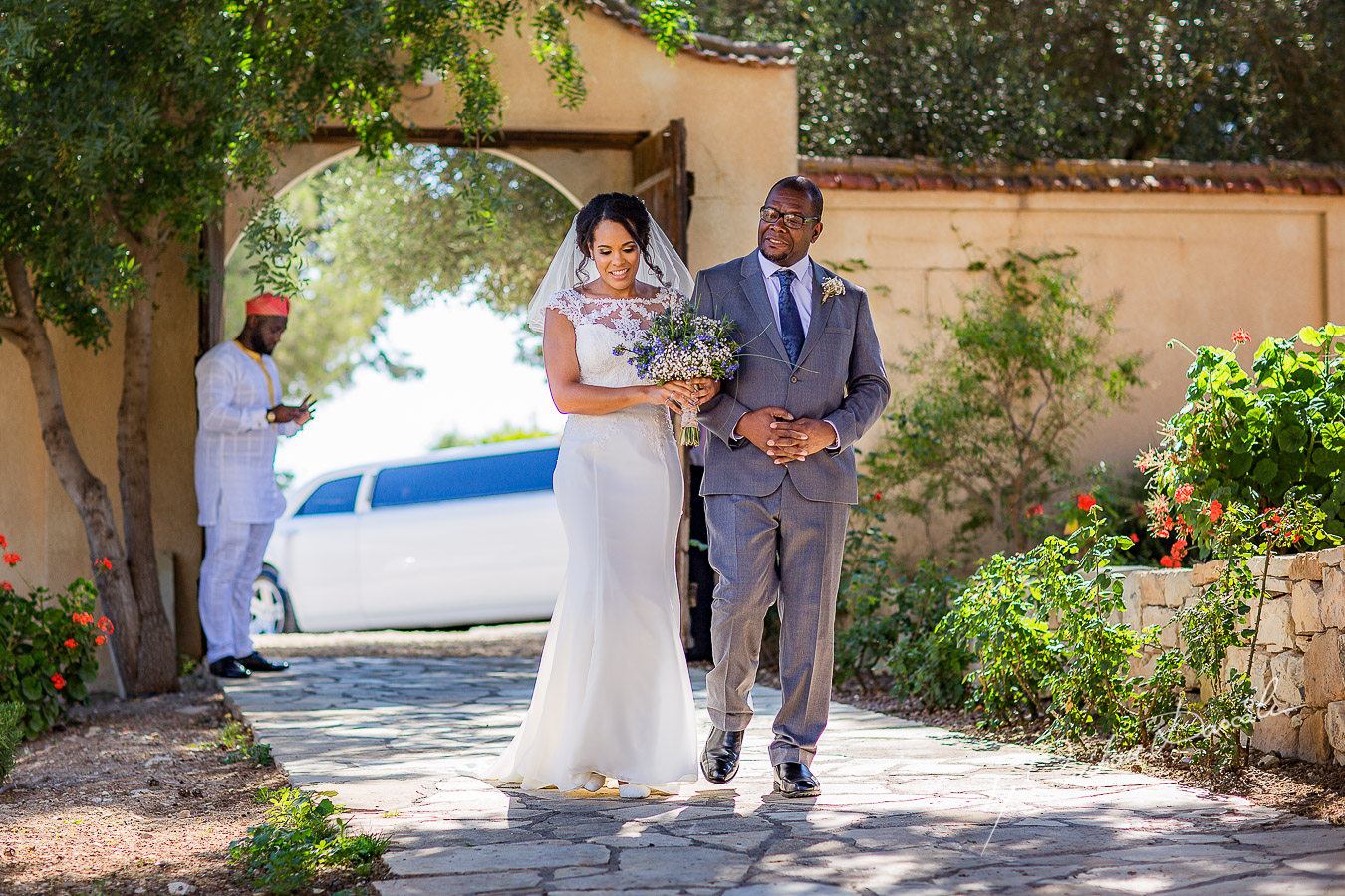 Emotional moment with the bride and her father captured at a wedding at Minthis Hills in Cyprus, by Cristian Dascalu.
