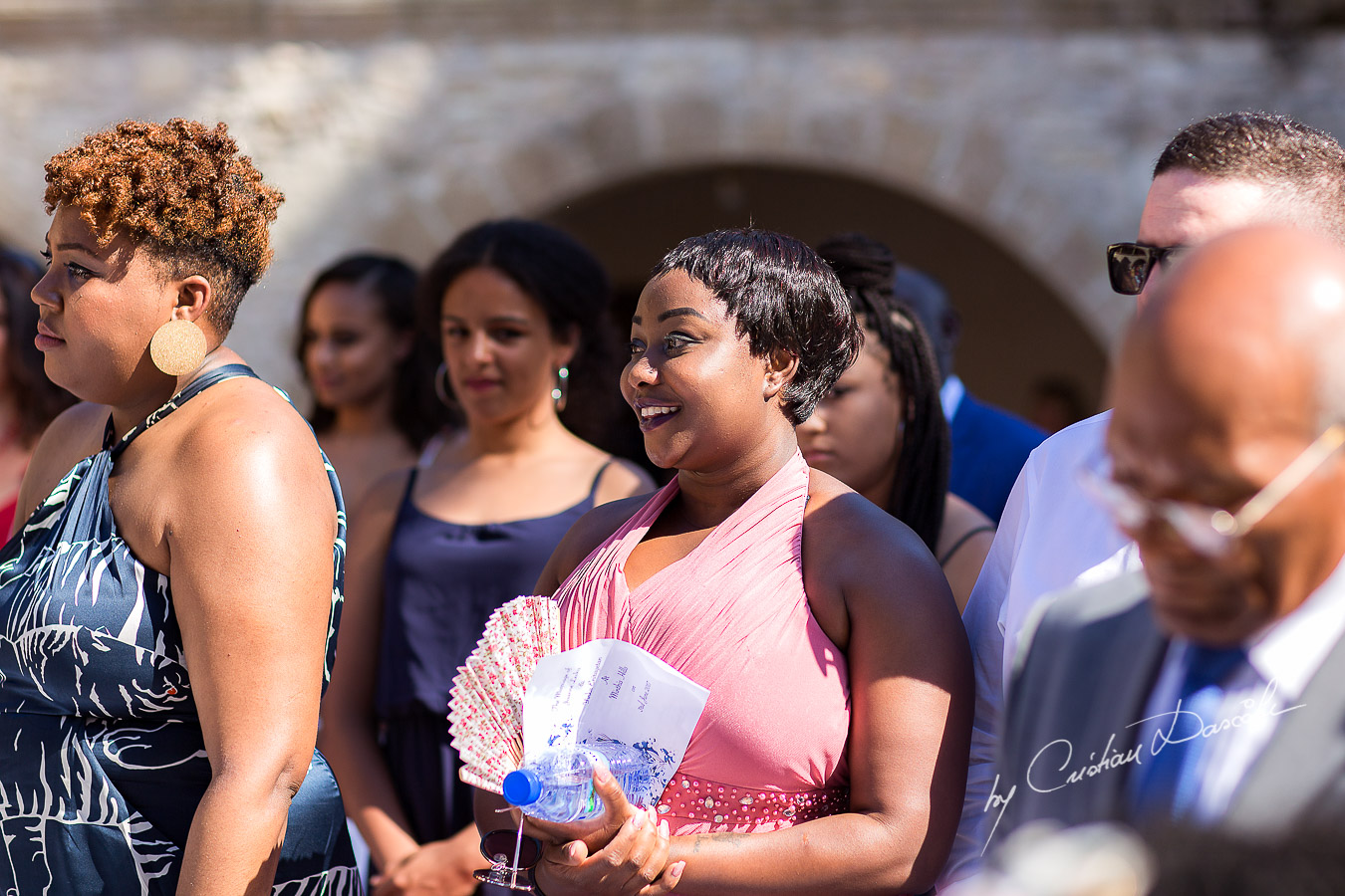 Moments with the guests smiling captured at a wedding at Minthis Hills in Cyprus, by Cristian Dascalu.