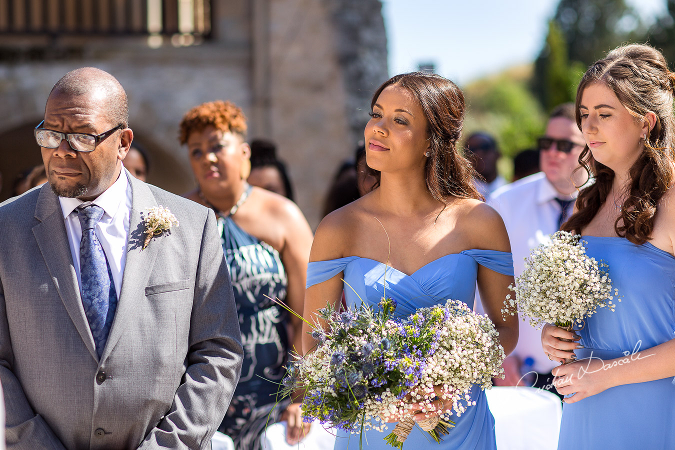 Bridesmaids smiling moments captured at a wedding at Minthis Hills in Cyprus, by Cristian Dascalu.