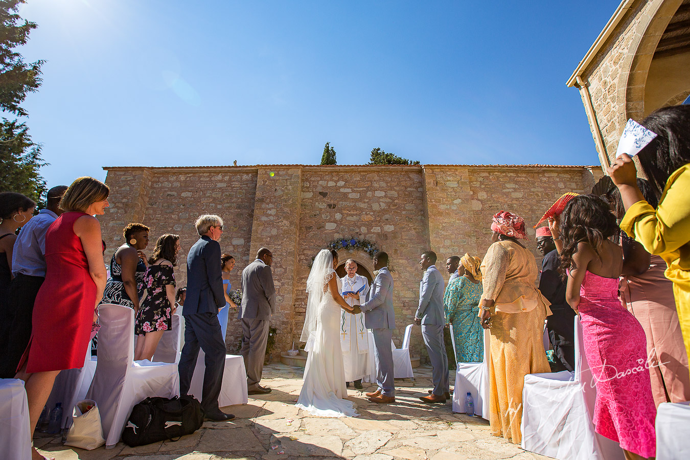 Beautiful ceremony moments captured at a wedding at Minthis Hills in Cyprus, by Cristian Dascalu.