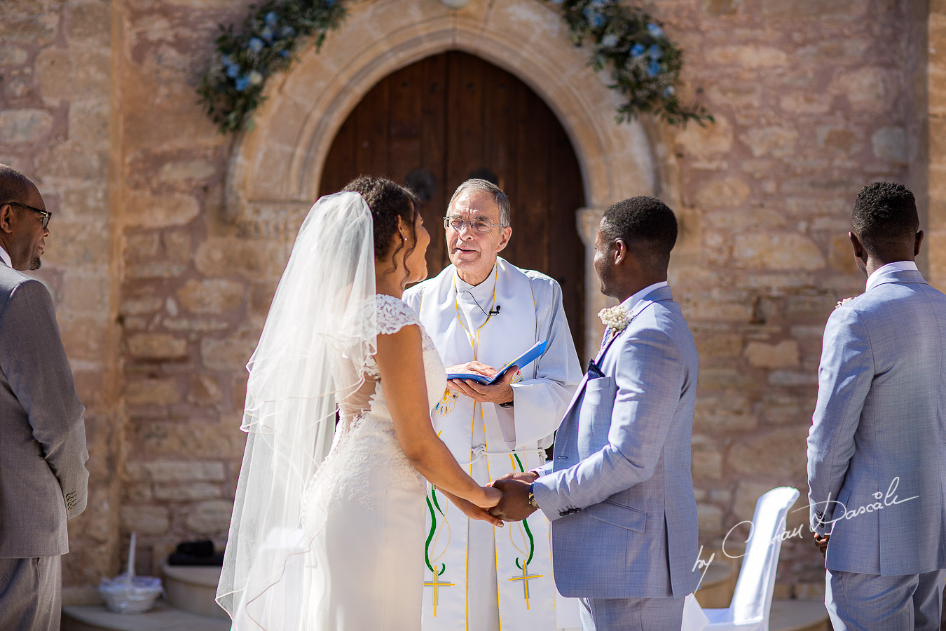 Beautiful ceremony moments captured at a wedding at Minthis Hills in Cyprus, by Cristian Dascalu.