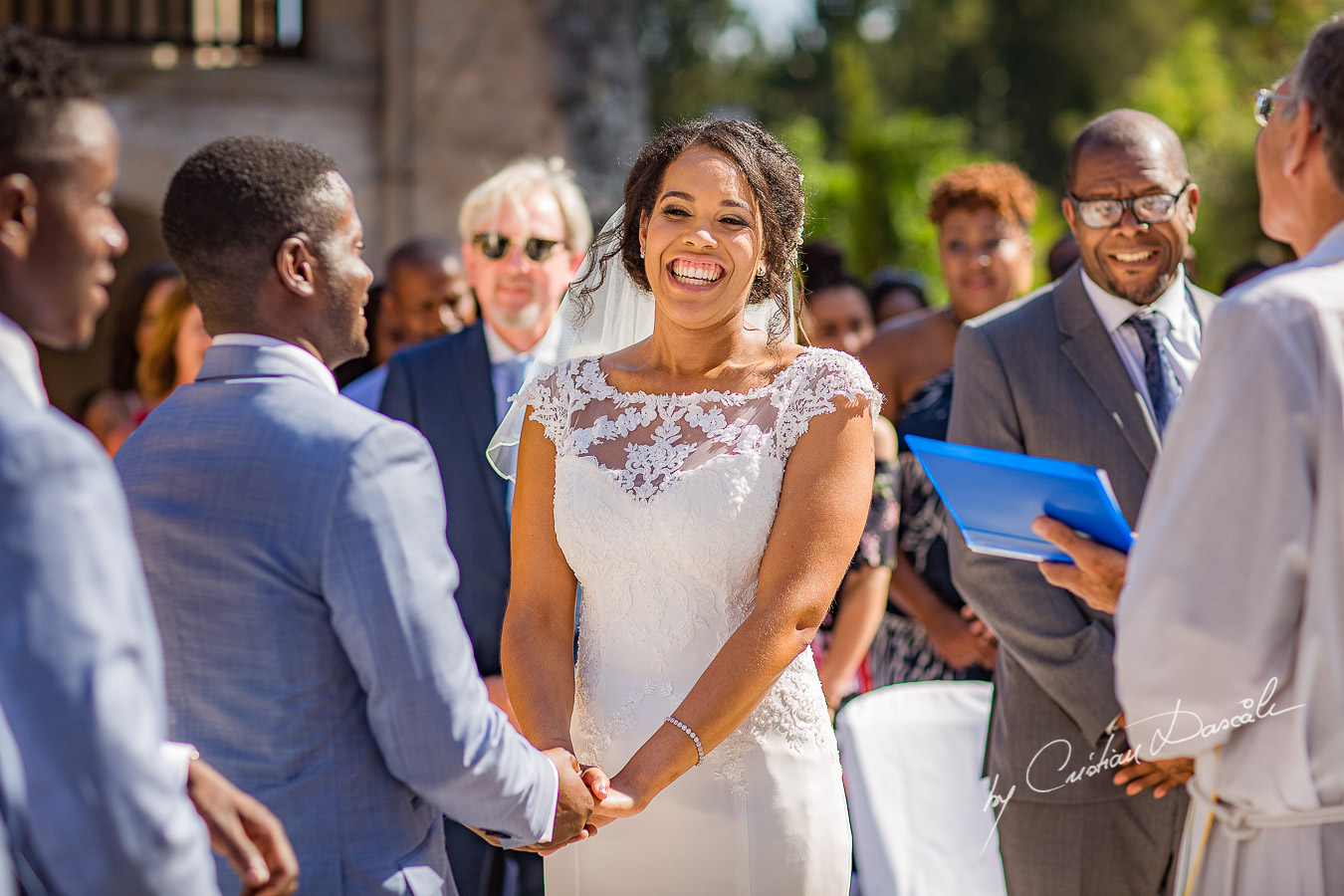 Beautiful ceremony moments captured at a wedding at Minthis Hills in Cyprus, by Cristian Dascalu.