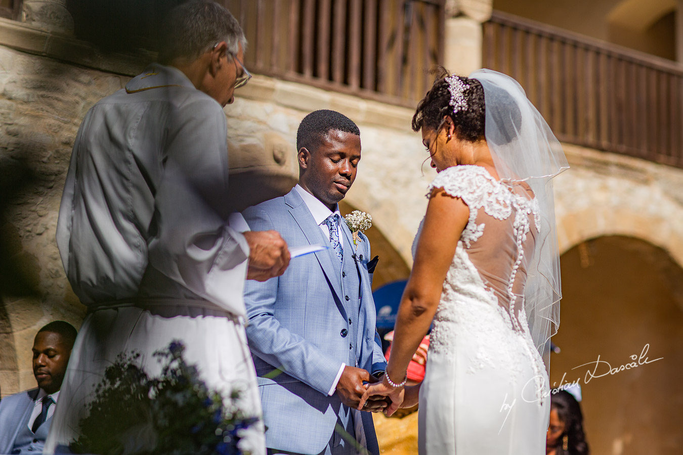 Beautiful ceremony moments captured at a wedding at Minthis Hills in Cyprus, by Cristian Dascalu.