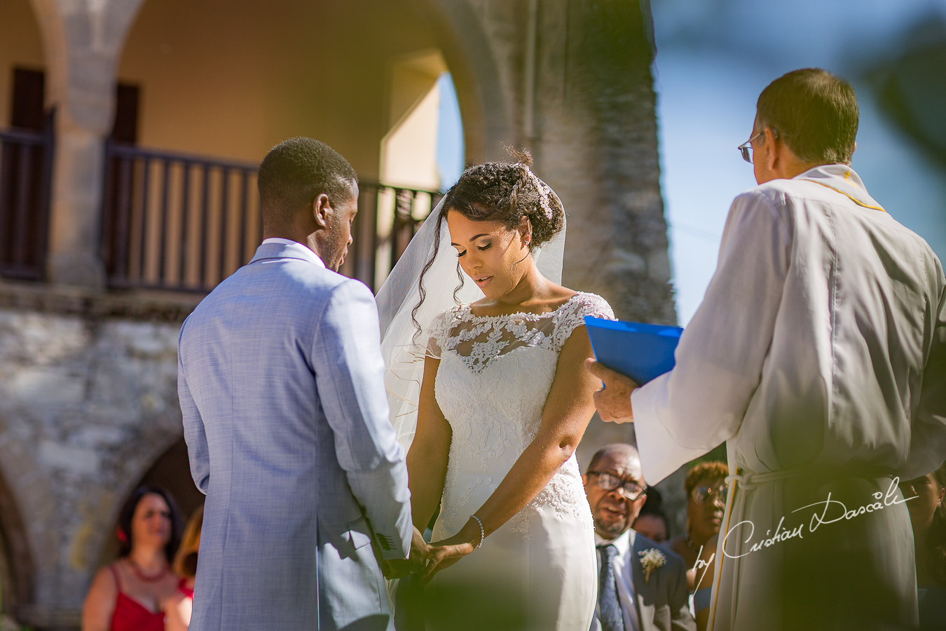 Beautiful ceremony moments captured at a wedding at Minthis Hills in Cyprus, by Cristian Dascalu.