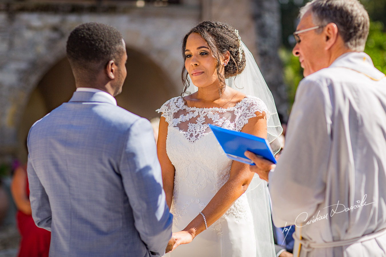 Beautiful ceremony moments captured at a wedding at Minthis Hills in Cyprus, by Cristian Dascalu.