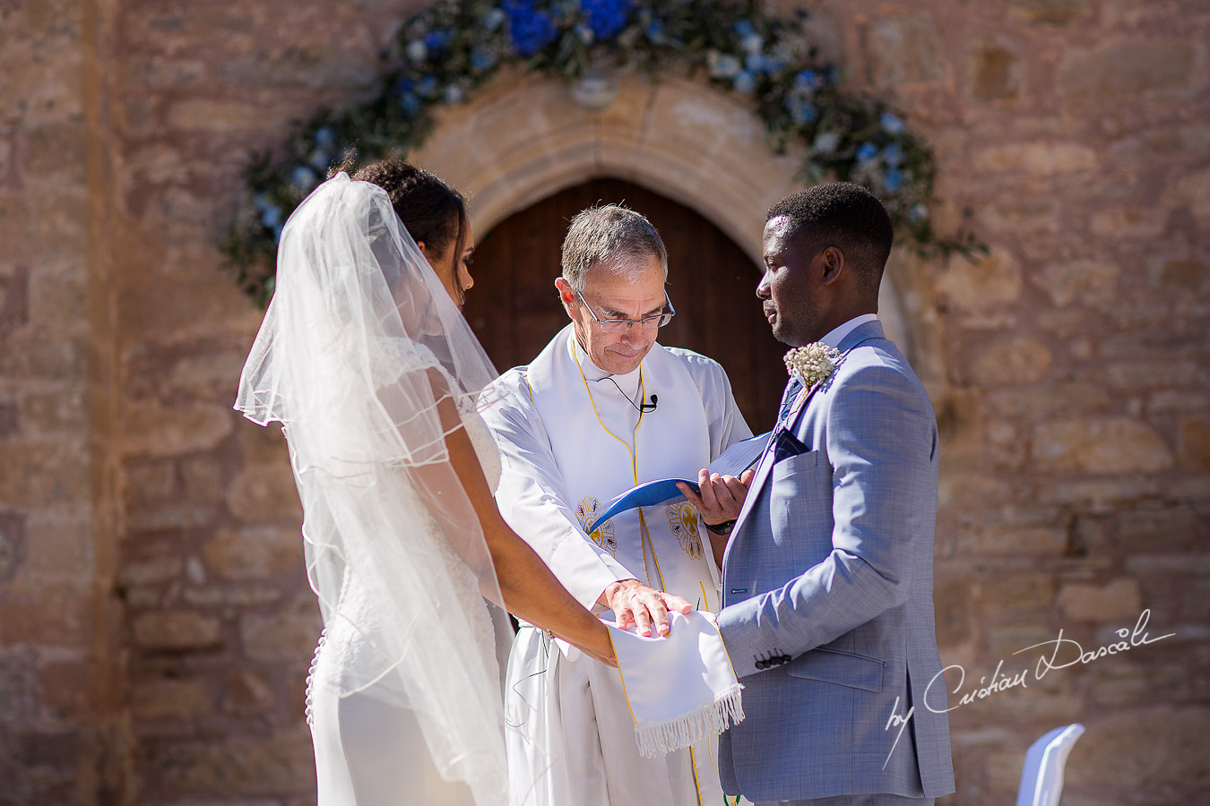 Beautiful ceremony moments captured at a wedding at Minthis Hills in Cyprus, by Cristian Dascalu.