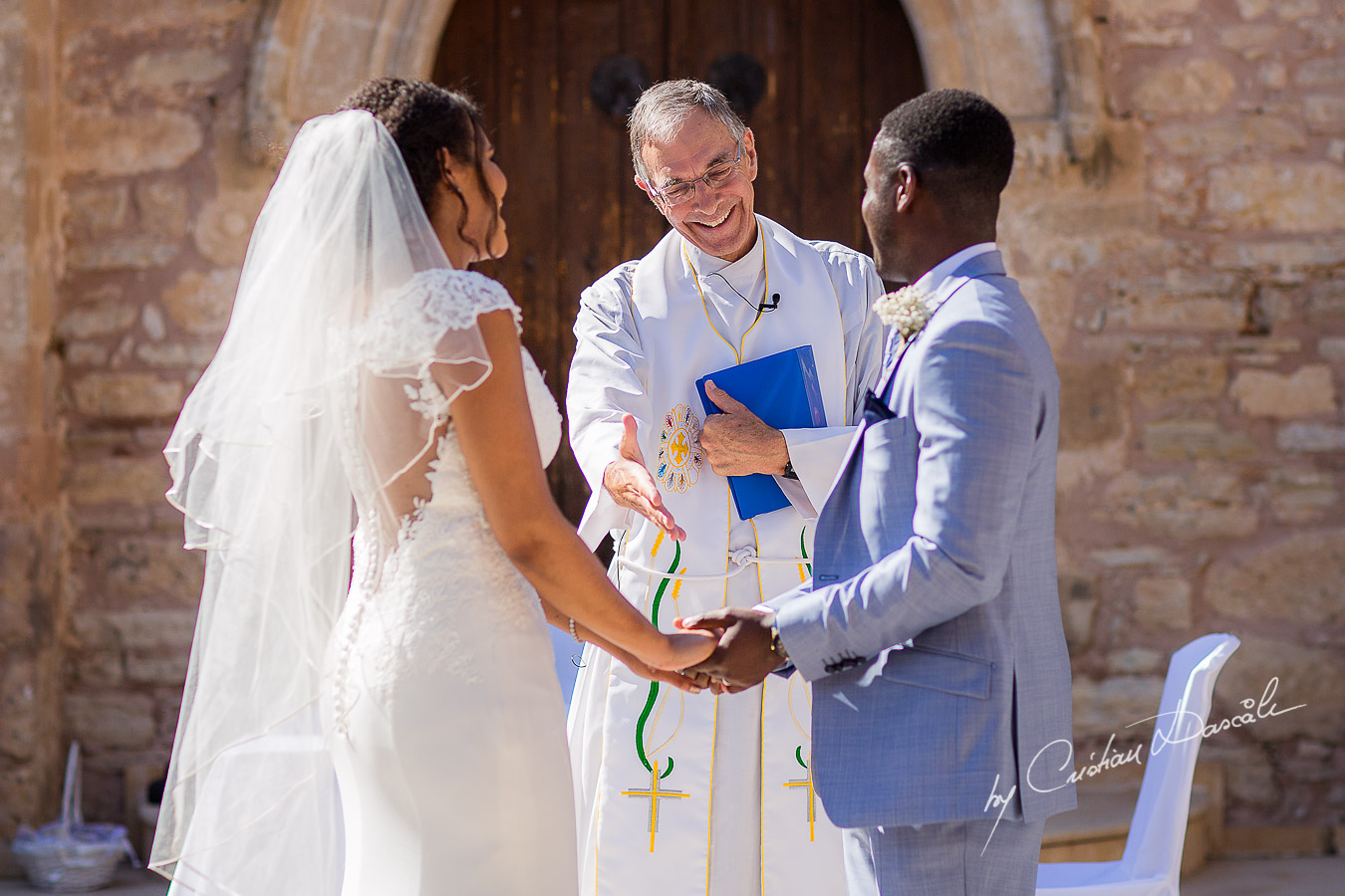 Beautiful ceremony moments captured at a wedding at Minthis Hills in Cyprus, by Cristian Dascalu.