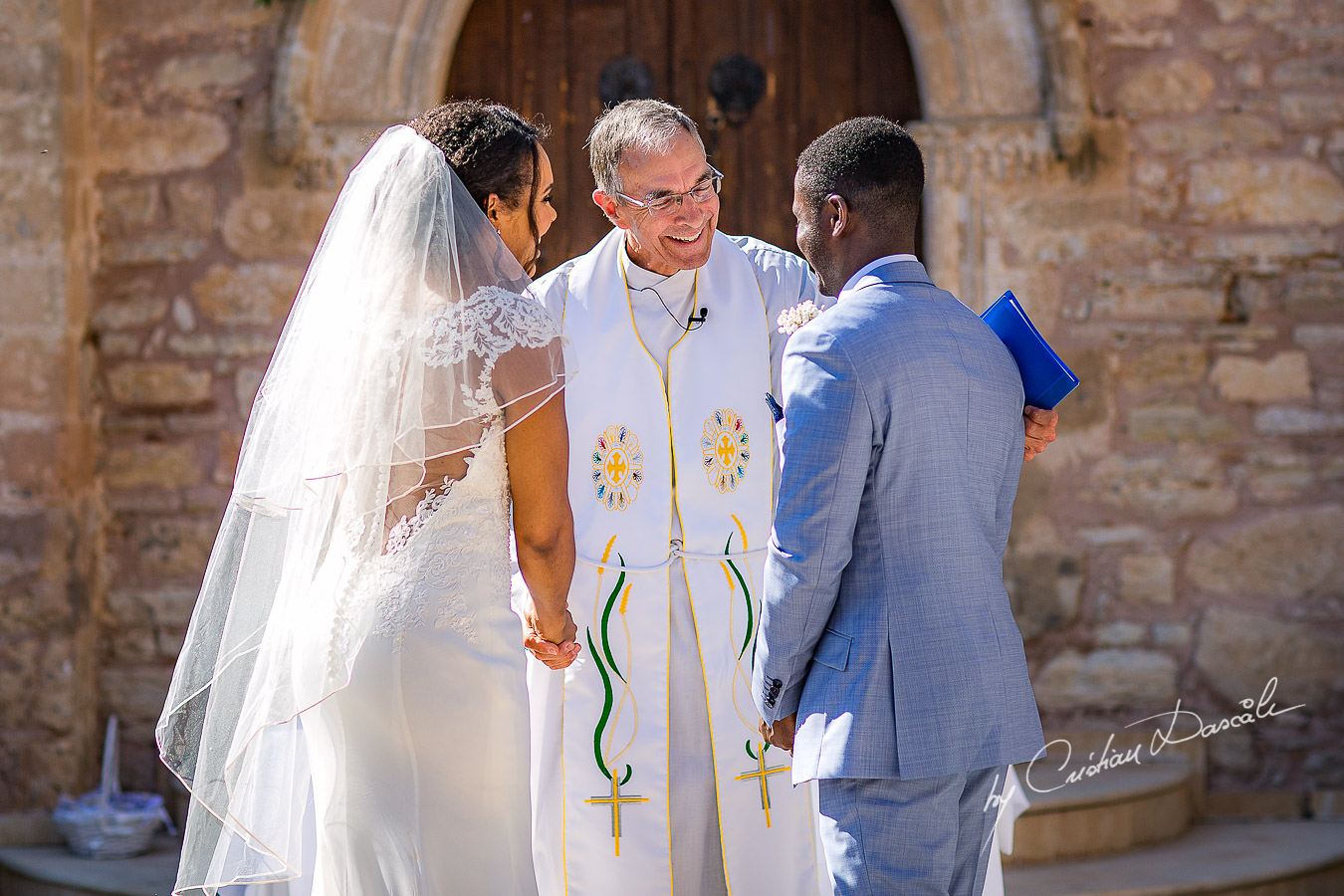 Beautiful ceremony moments captured at a wedding at Minthis Hills in Cyprus, by Cristian Dascalu.